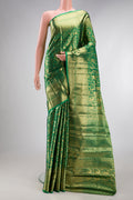 Green Kanjivaram Silk Saree with Zari Brocade on the body and Zari Border.  displayed on a mannequin