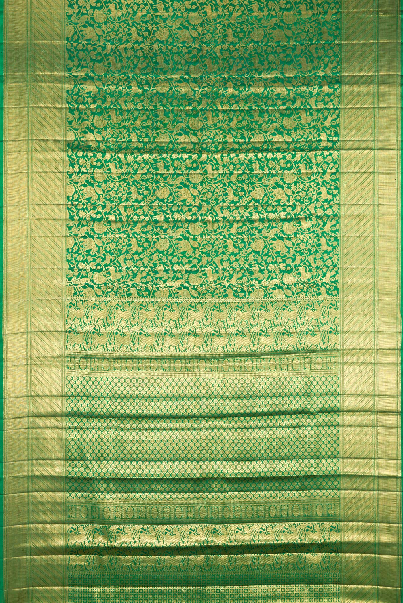 Flat view of Green Kanjivaram Silk Saree with Zari Brocade on the body and Zari Border. 