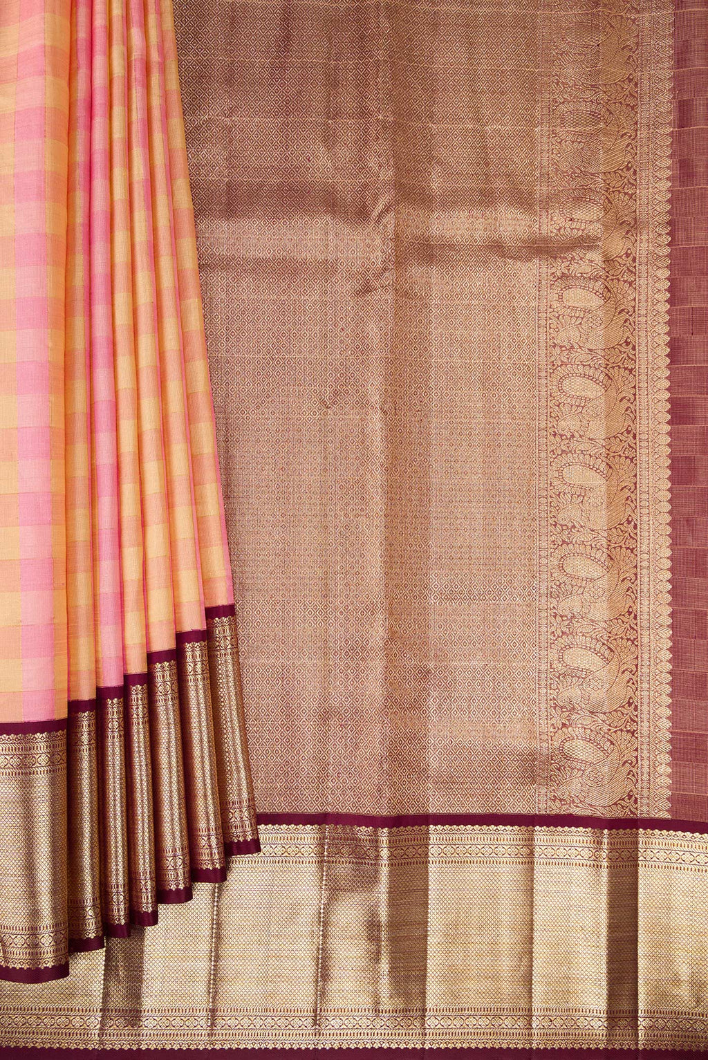 Pleats and pallu of Pure Silk Rose pink Kanjivaram Tissue Saree with Checked design on the body and Zari Border. 