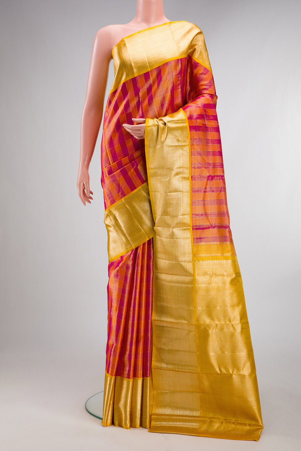 Multi Color Kanjivaram Tissue Saree with Checked design on the body and Zari Border.  displayed on a mannequin