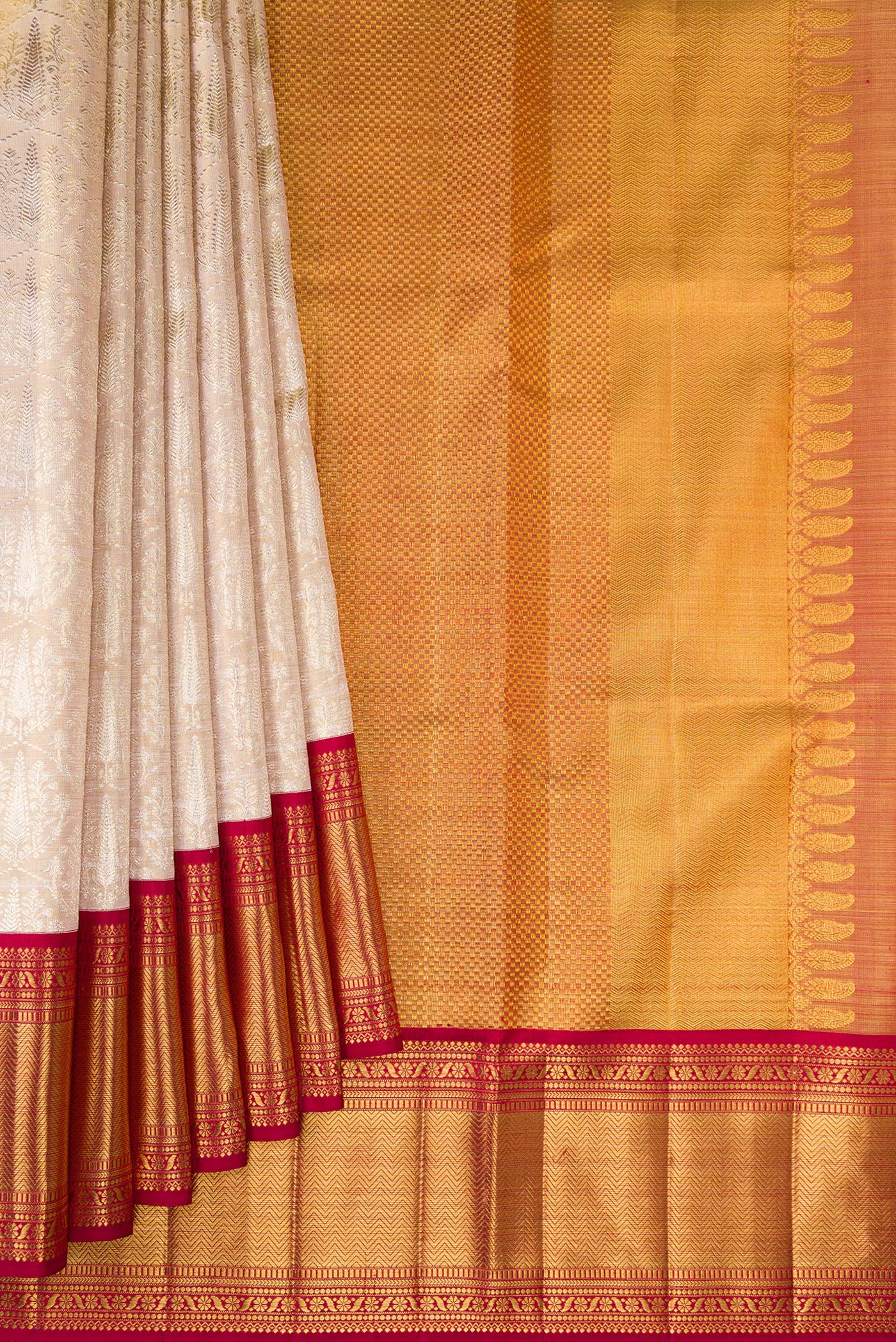 Pleats and pallu of Golden Peach Kanjivaram Tissue Silk Saree with Zari Brocade on the body and Zari Border. 