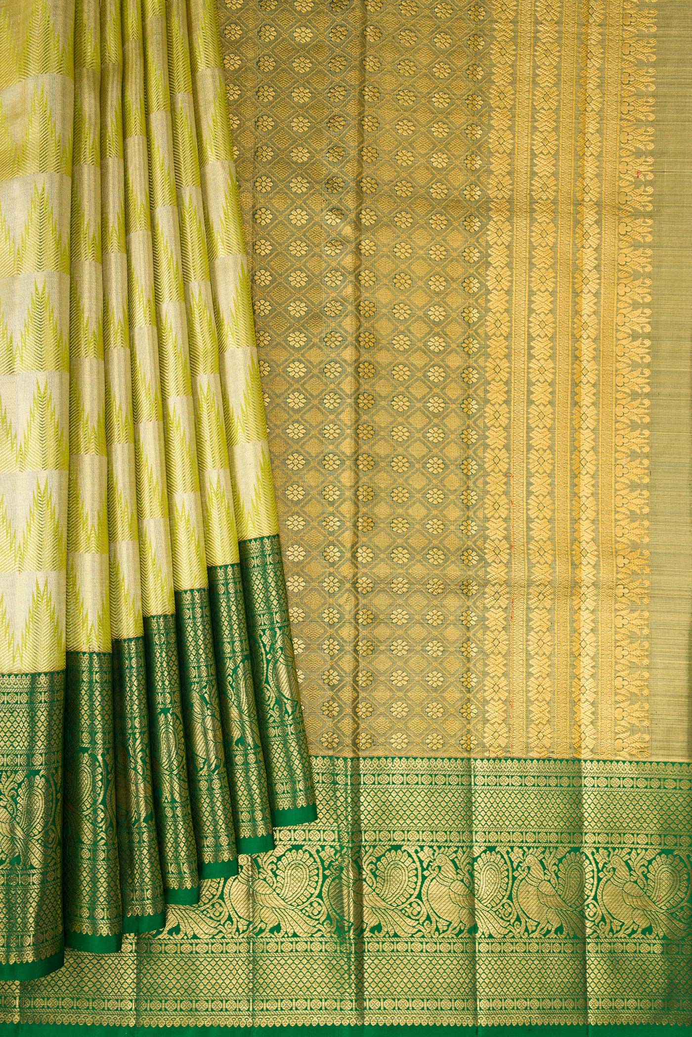 Pleats and pallu of Parrot Green Dual Tone Kanjivaram Tissue Silk Saree with Zari Brocade on the body and Fancy Border. 