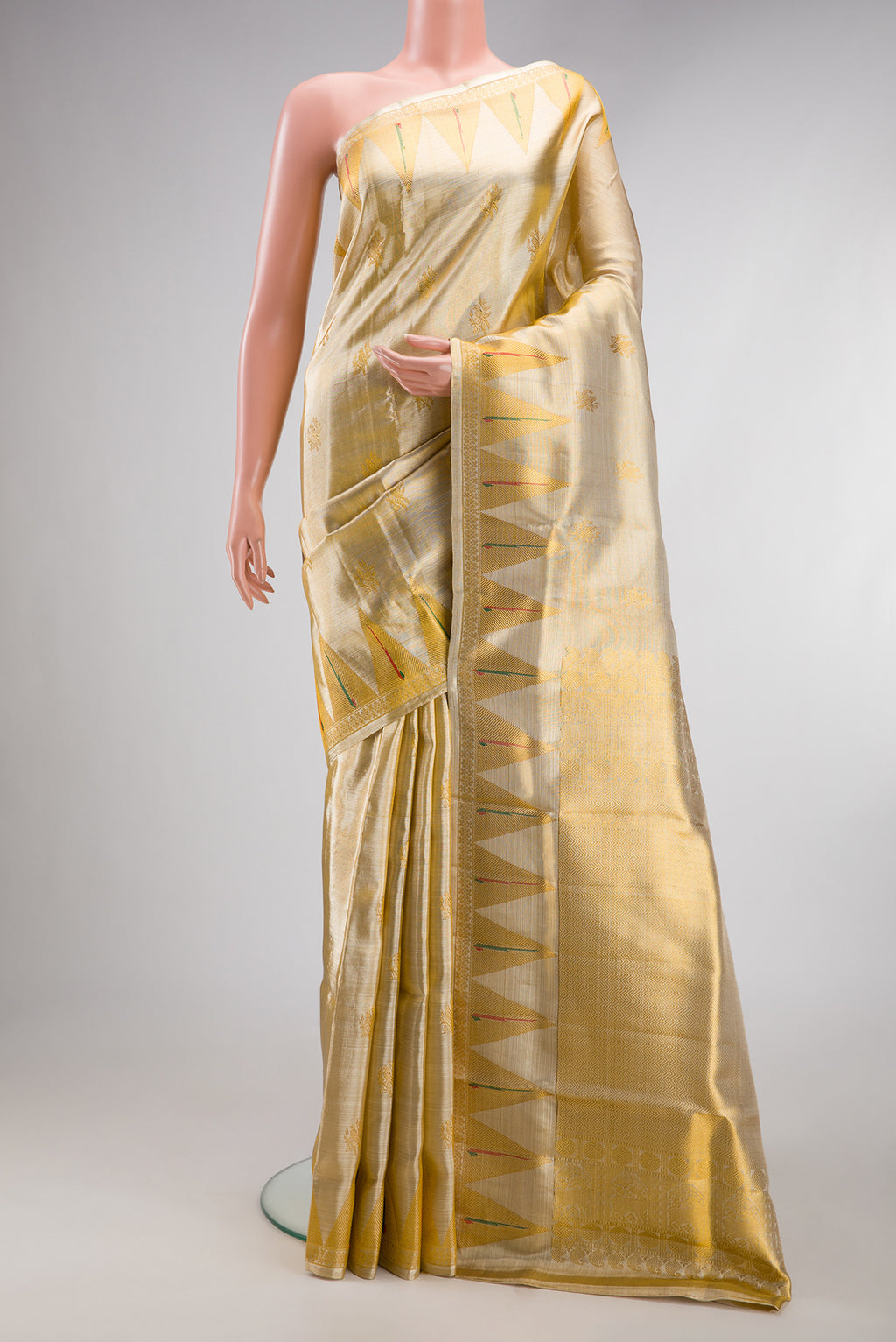Gold Kanjivaram Tissue Silk Saree with Zari Brocade on the body and Paithani Border.  displayed on a mannequin