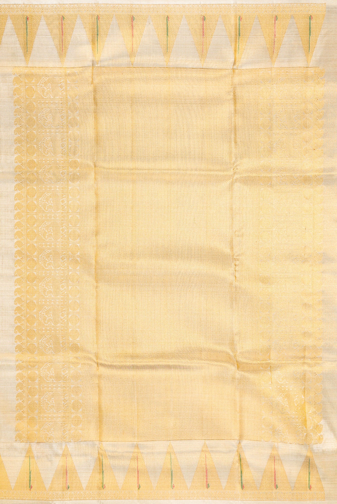 Close up image of the pallu of Gold Kanjivaram Tissue Silk Saree with Zari Brocade on the body and Paithani Border. 