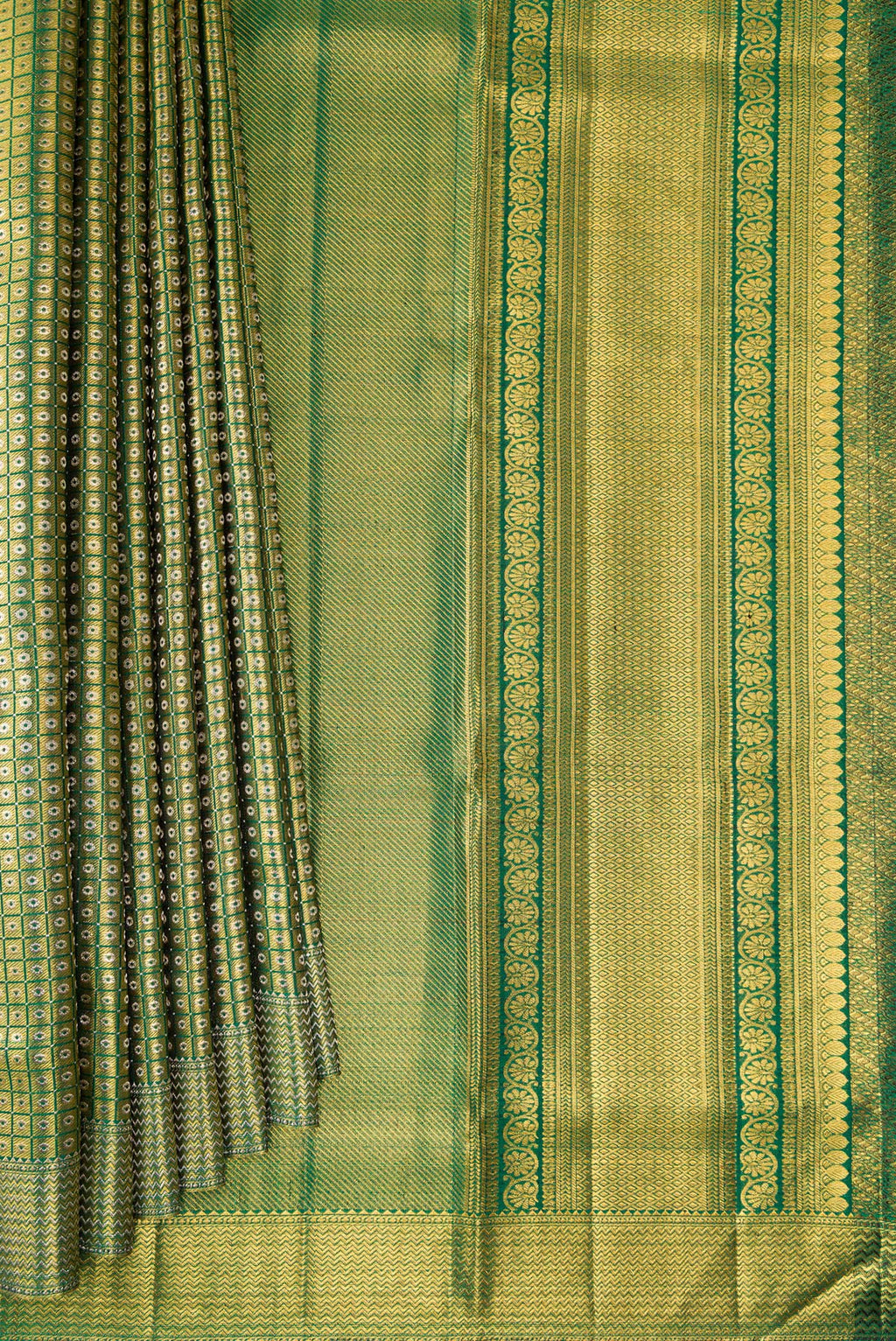 Pleats and pallu of Green Kanjivaram Silk Saree with Zari Brocade on the body and Zari Border. 