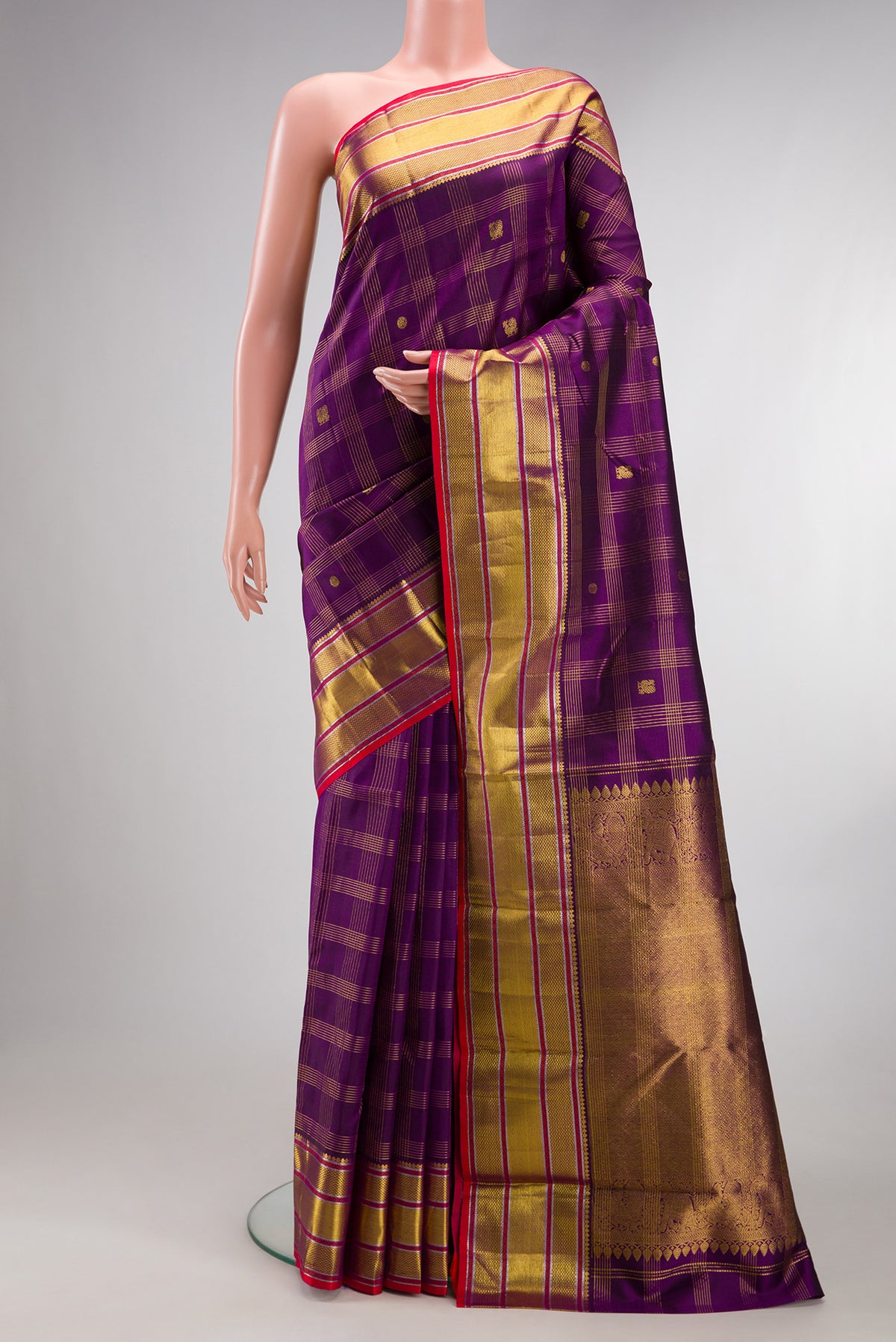 Pure Silk Purple Kanjivaram Saree with Checked design on the body and Zari Border.  displayed on a mannequin
