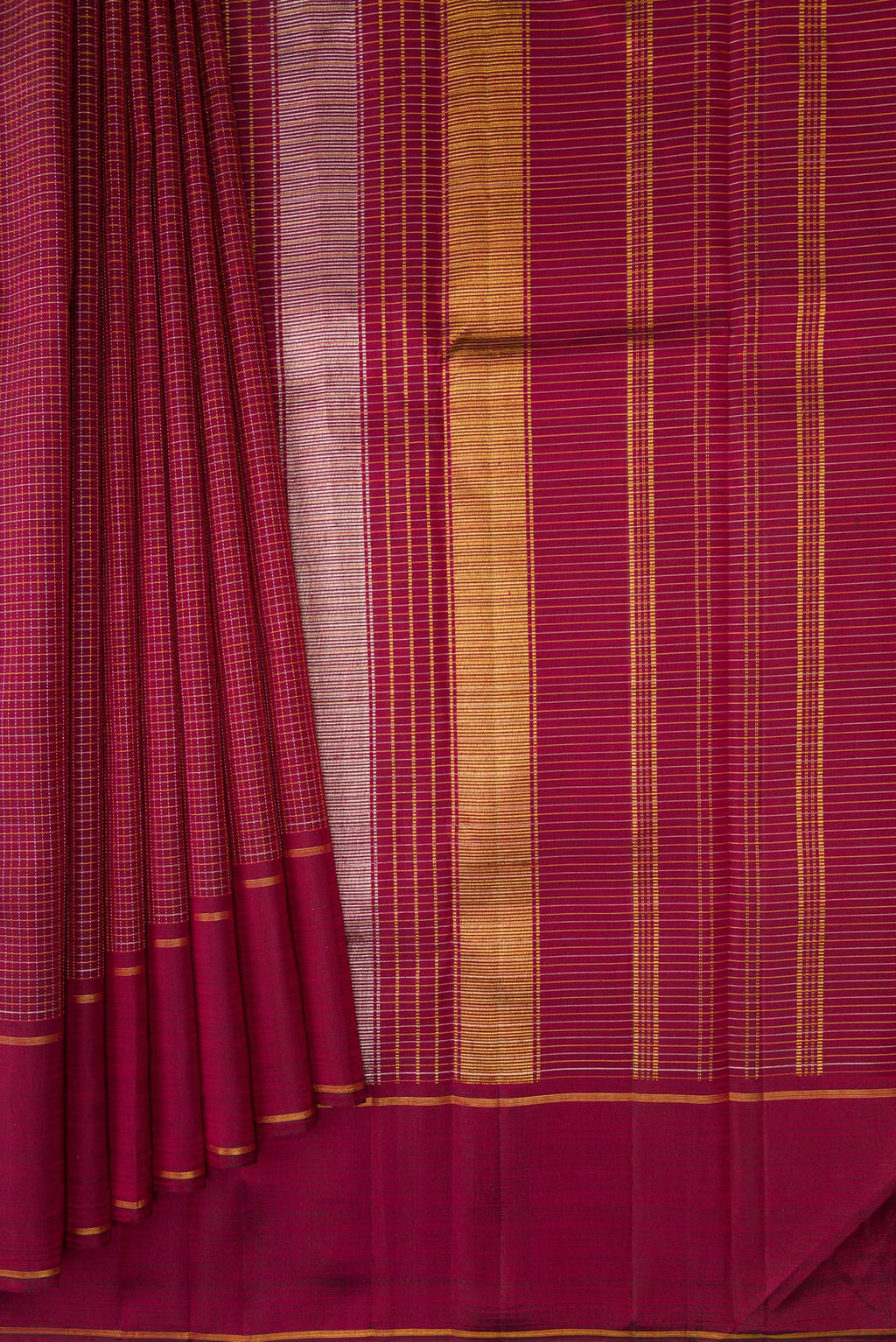 Pleats and pallu of Maroon Kanchipuram Silk Saree with Stripes on the body and Zari Border. 