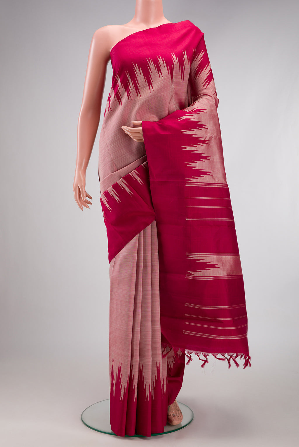 Rose Gold Kanchipuram Silk Saree with Plain Body and Temple Border.  displayed on a mannequin