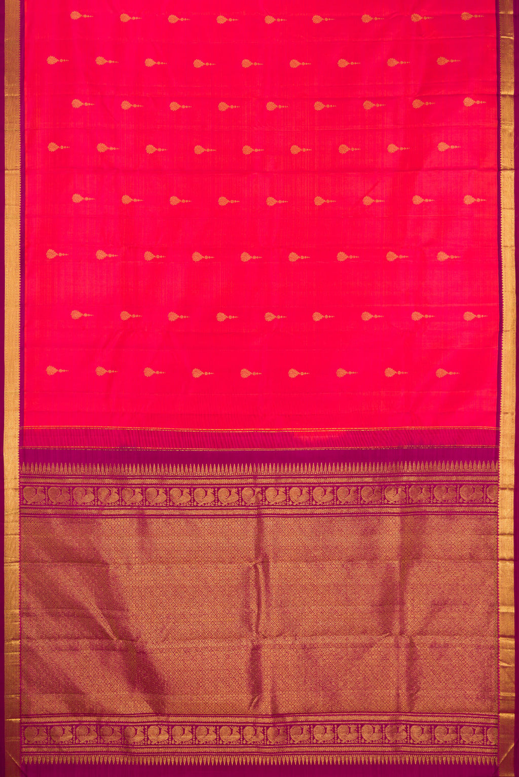 Flat view of Pure Silk Coral Dual Tone Kanchipuram Saree with Zari Butta on the body and Zari Border. 