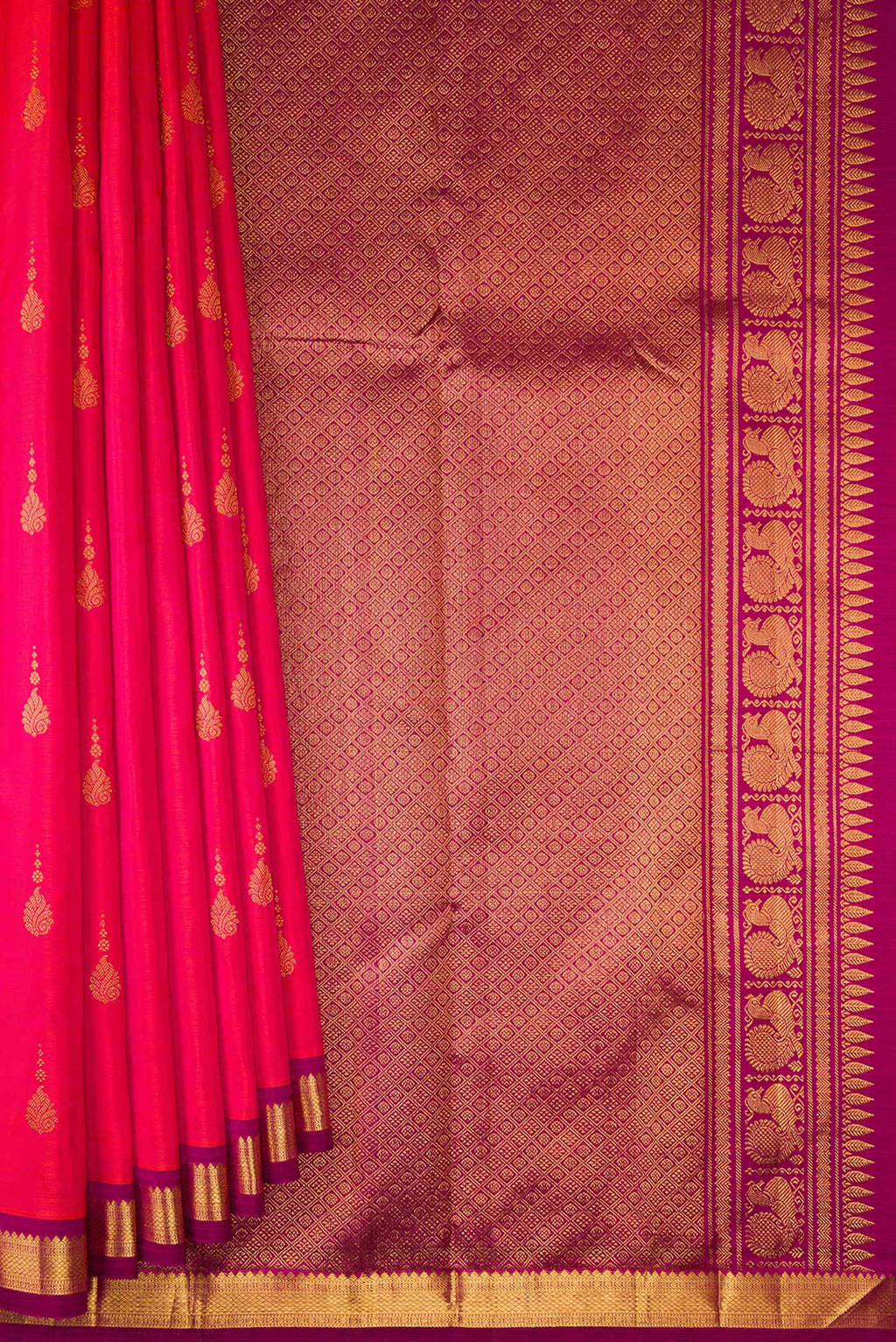 Pleats and pallu of Pure Silk Coral Dual Tone Kanchipuram Saree with Zari Butta on the body and Zari Border. 