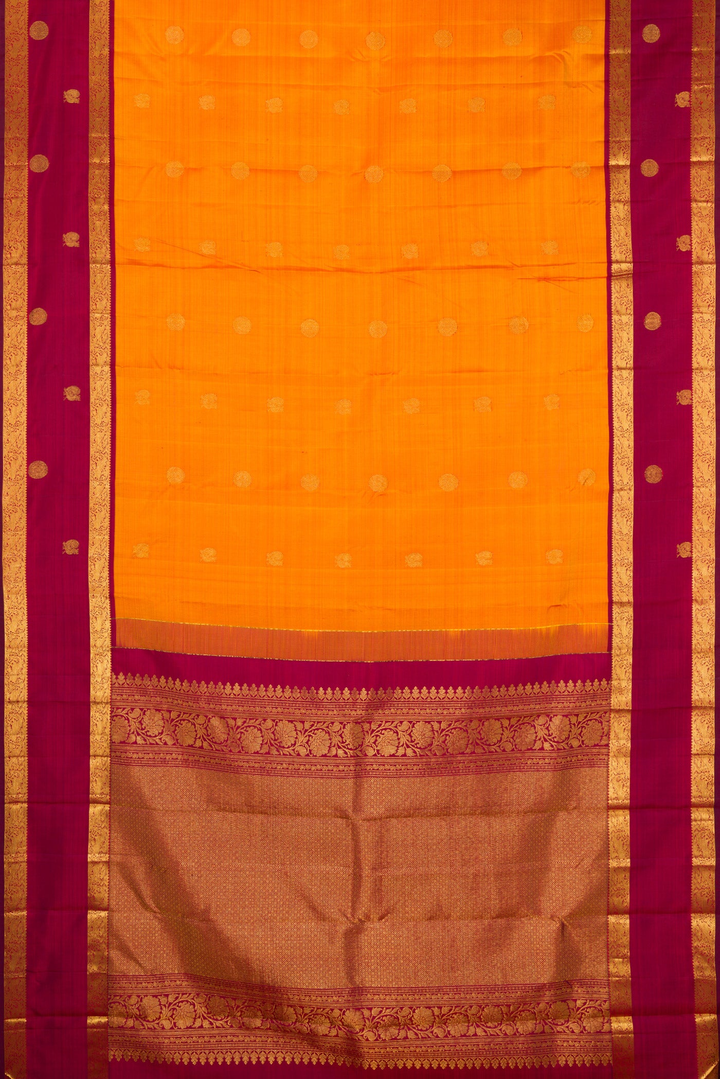 Flat view of Mustard Kanjivaram Silk Saree with Zari Butta on the body and Zari Border. 