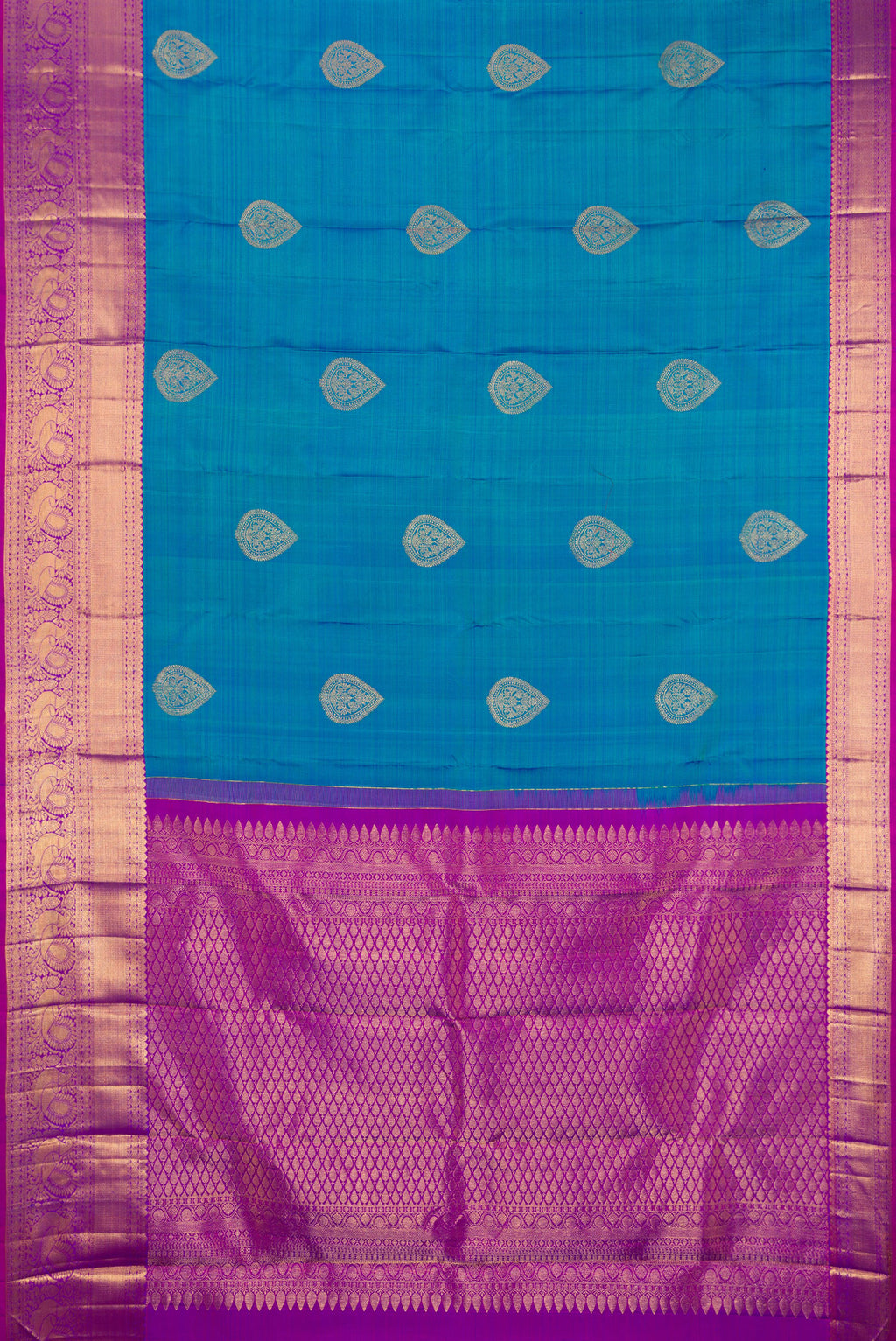 Flat view of Peacock Blue Kanjivaram Silk Saree with Zari Butta on the body and Fancy Border. 