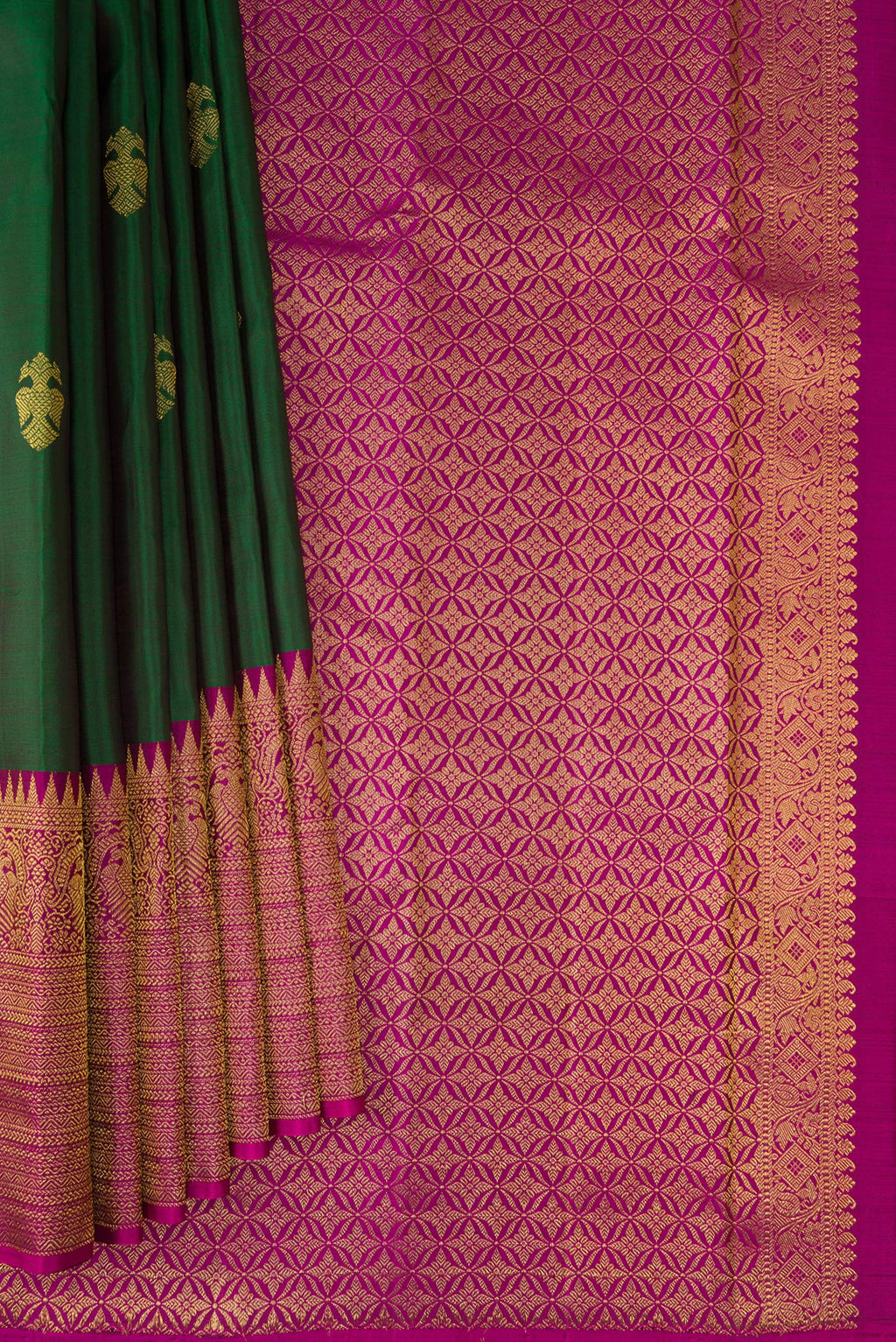 Pleats and pallu of Bottle Green Kanjivaram Silk Saree with Zari Butta on the body and Fancy Border. 