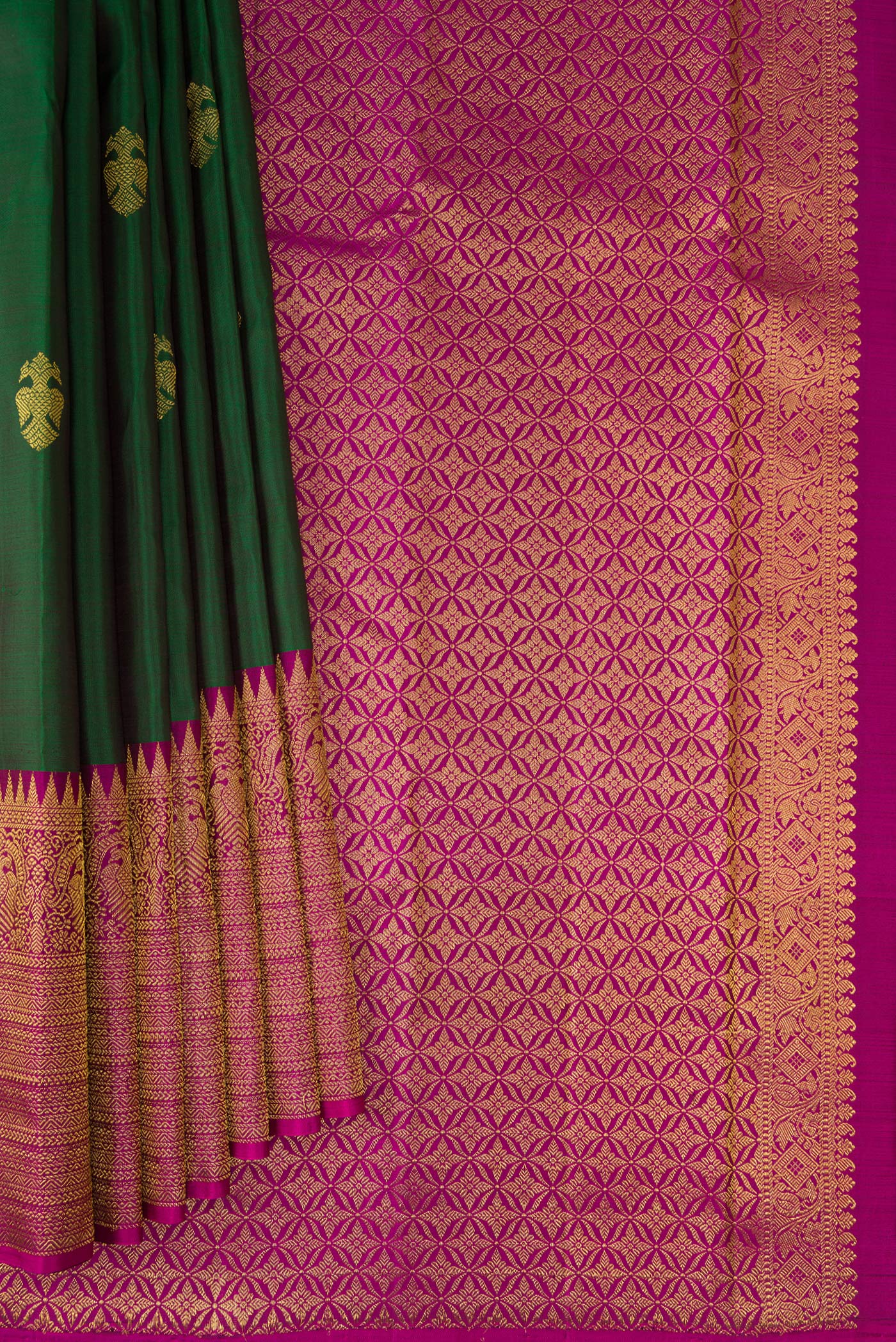 Pleats and pallu of Bottle Green Kanjivaram Silk Saree with Zari Butta on the body and Fancy Border. 
