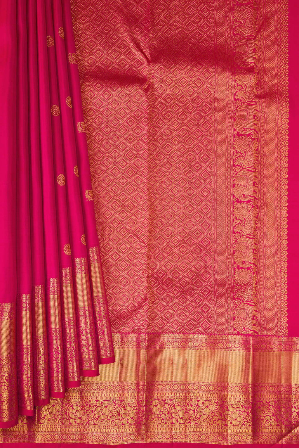 Pleats and pallu of Dark Pink Kanjivaram Silk Saree with Zari Butta on the body and Zari Border. 