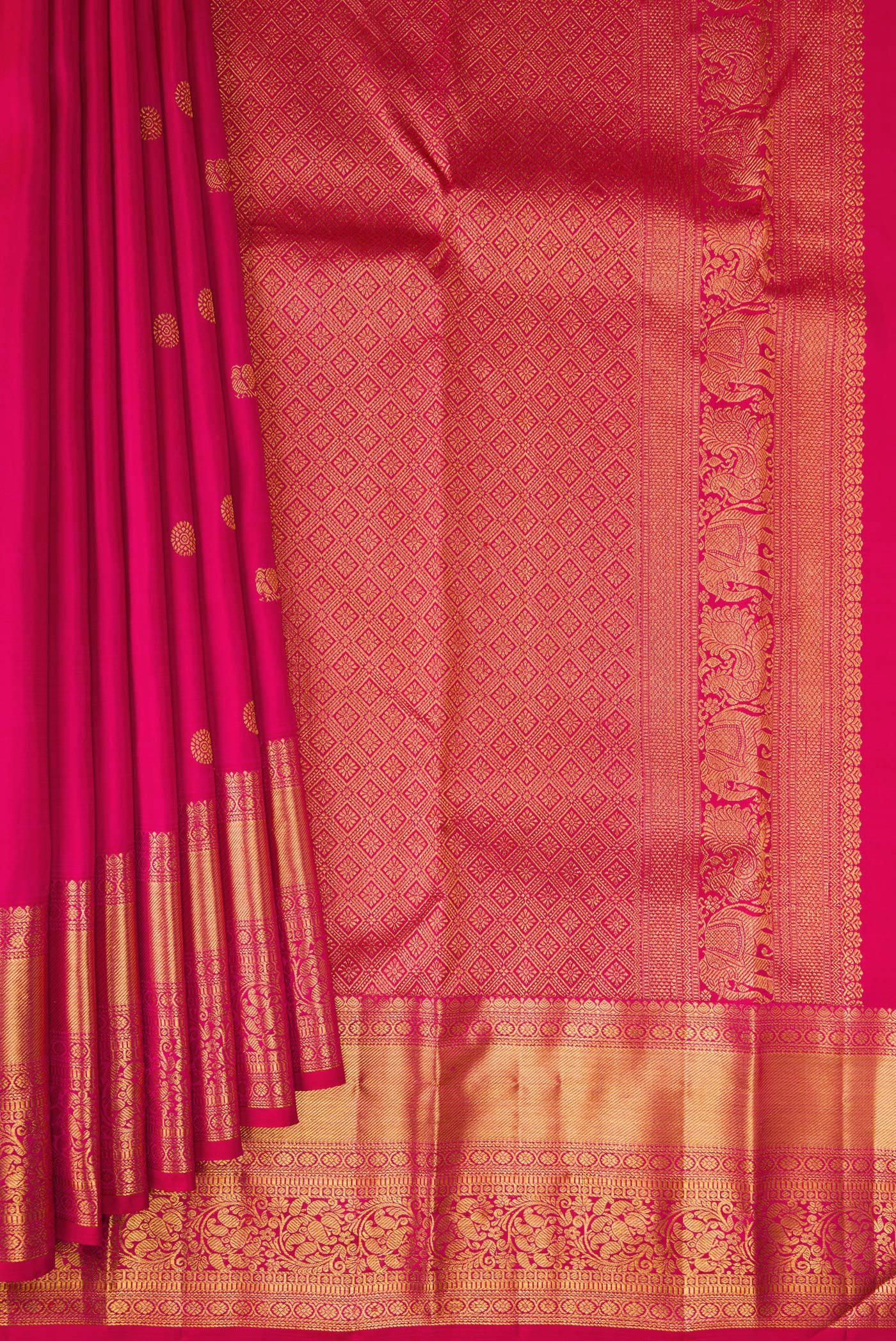 Pleats and pallu of Dark Pink Kanjivaram Silk Saree with Zari Butta on the body and Zari Border. 
