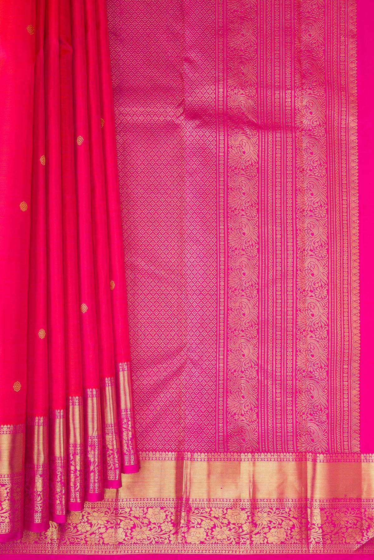 Pleats and pallu of Pink Kanjivaram Silk Saree with Zari Butta on the body and Zari Border. 