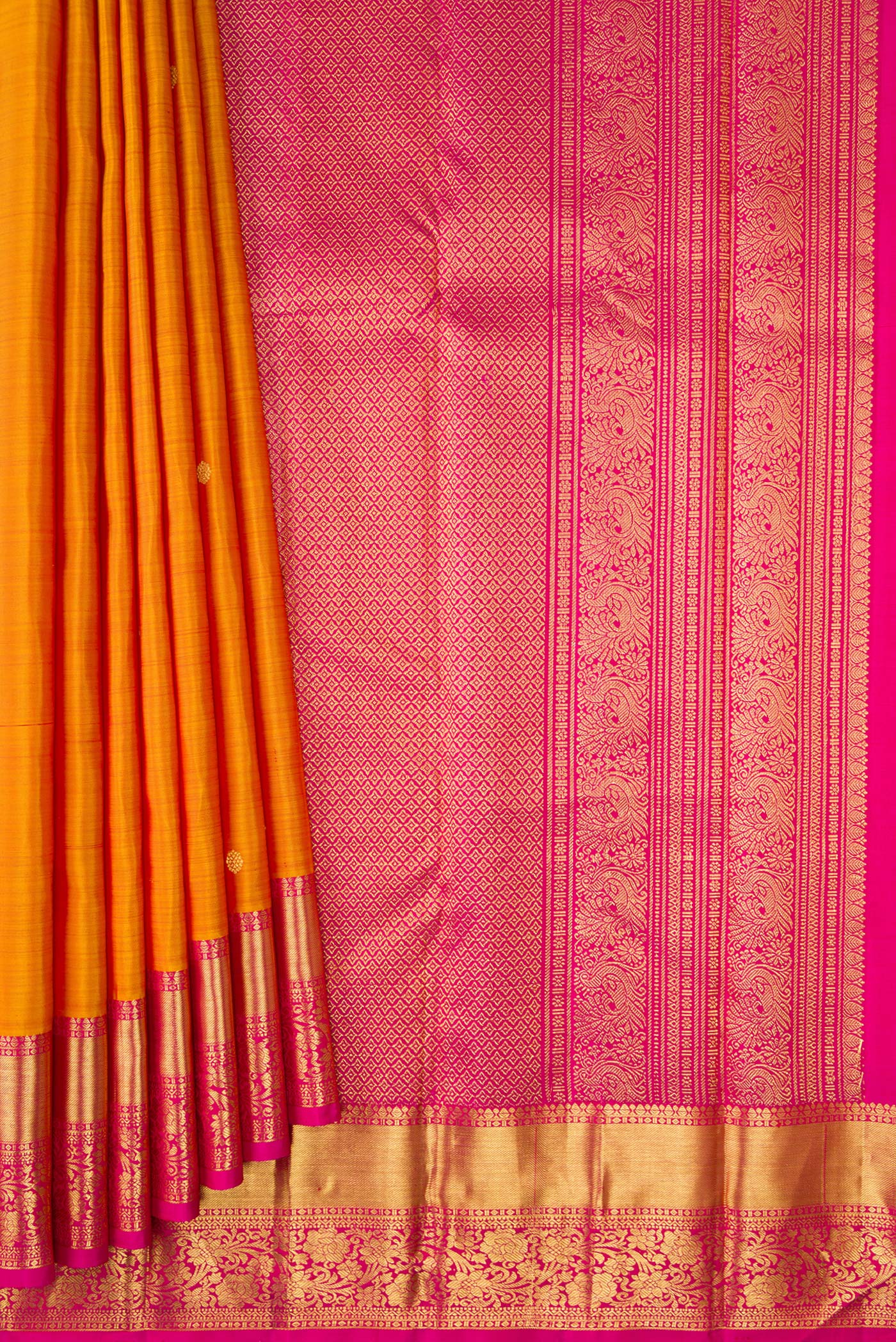 Pleats and pallu of Mustard Kanjivaram Silk Saree with Zari Butta on the body and Zari Border. 