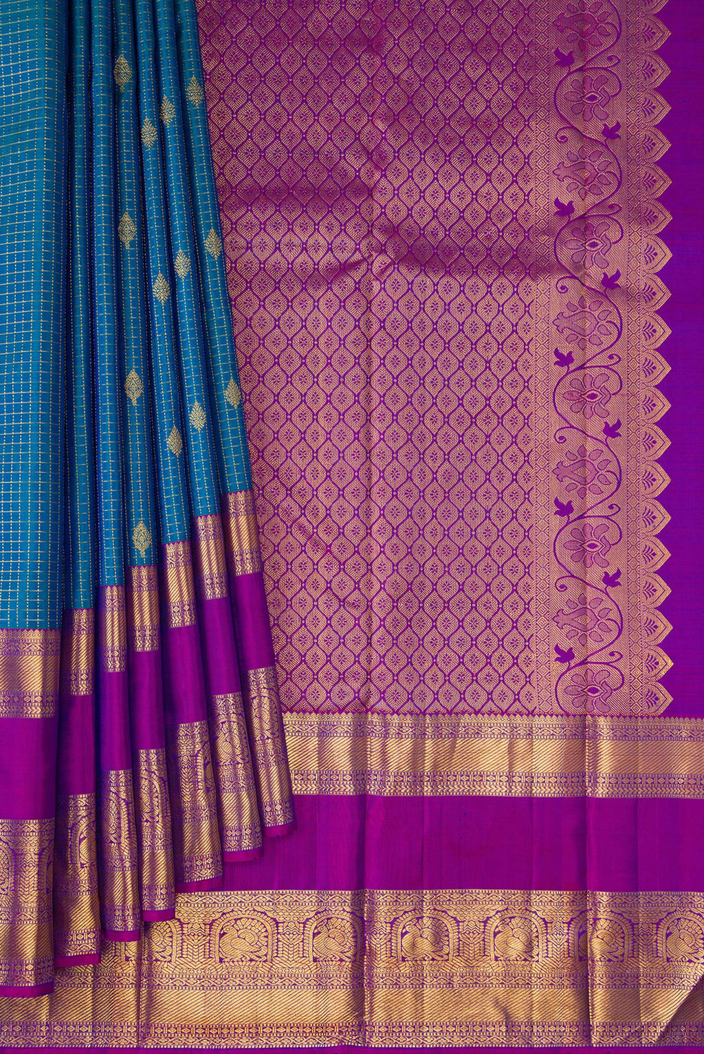 Pleats and pallu of Peacock Blue Dual Tone Kanjivaram Silk Saree with Checked design on the body and Fancy Border. 