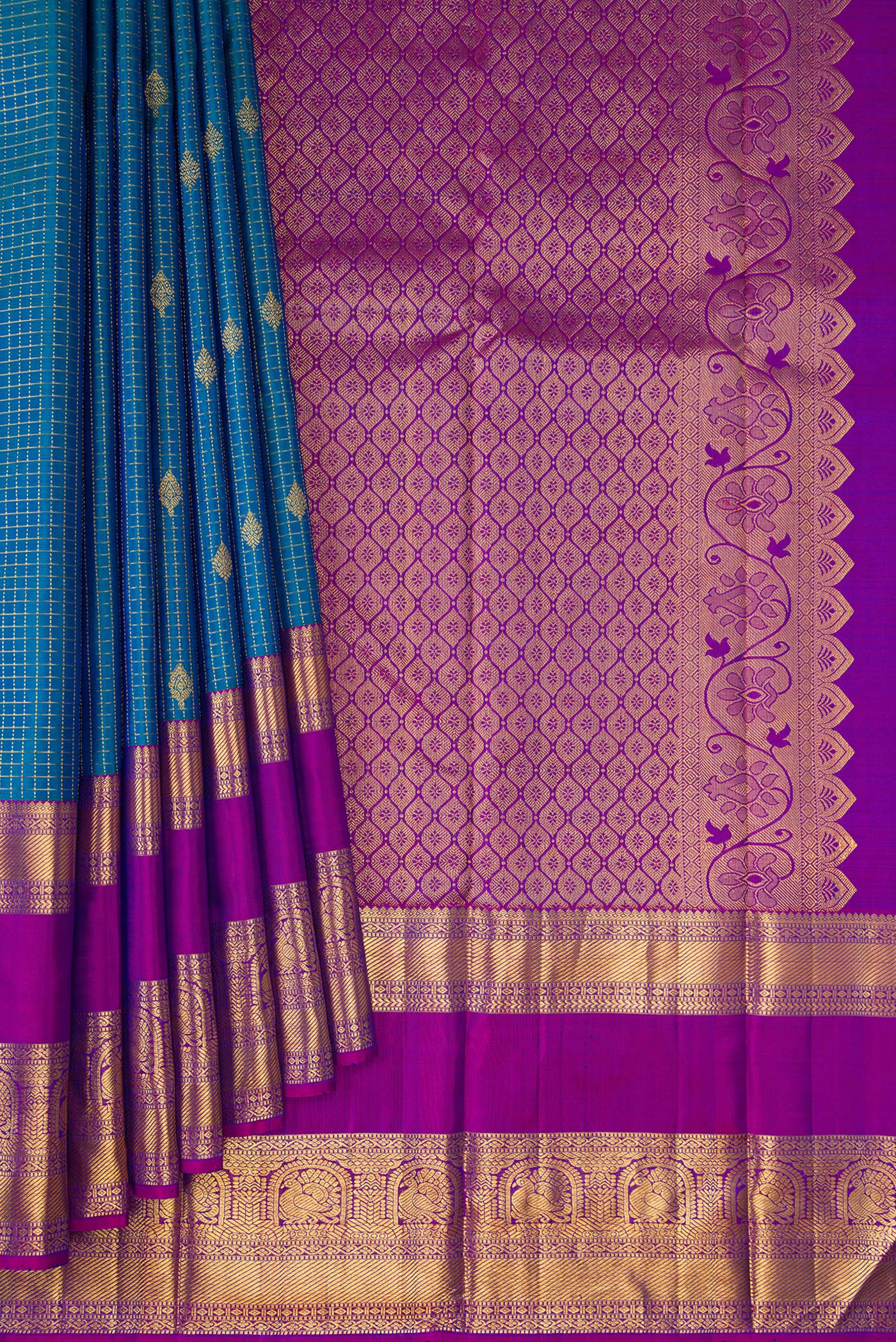 Pleats and pallu of Peacock Blue Dual Tone Kanjivaram Silk Saree with Checked design on the body and Fancy Border. 