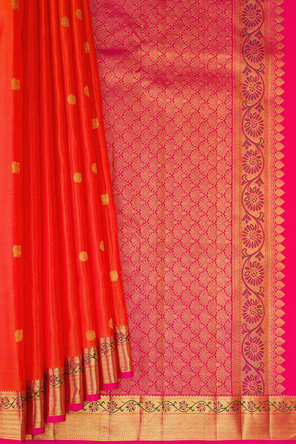 Pleats and pallu of Orange Kanjivaram Silk Saree with Zari Butta on the body and Zari And Thread Border. 