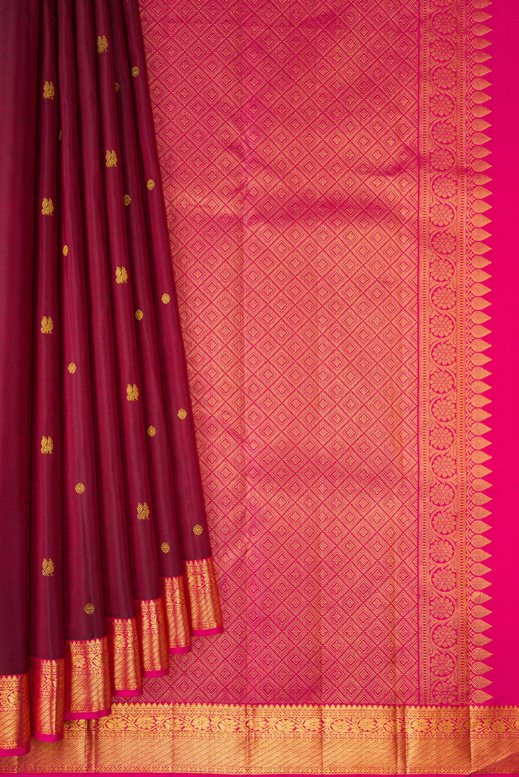 Pleats and pallu of Maroon Kanjivaram Silk Saree with Zari Butta on the body and Zari Border. 