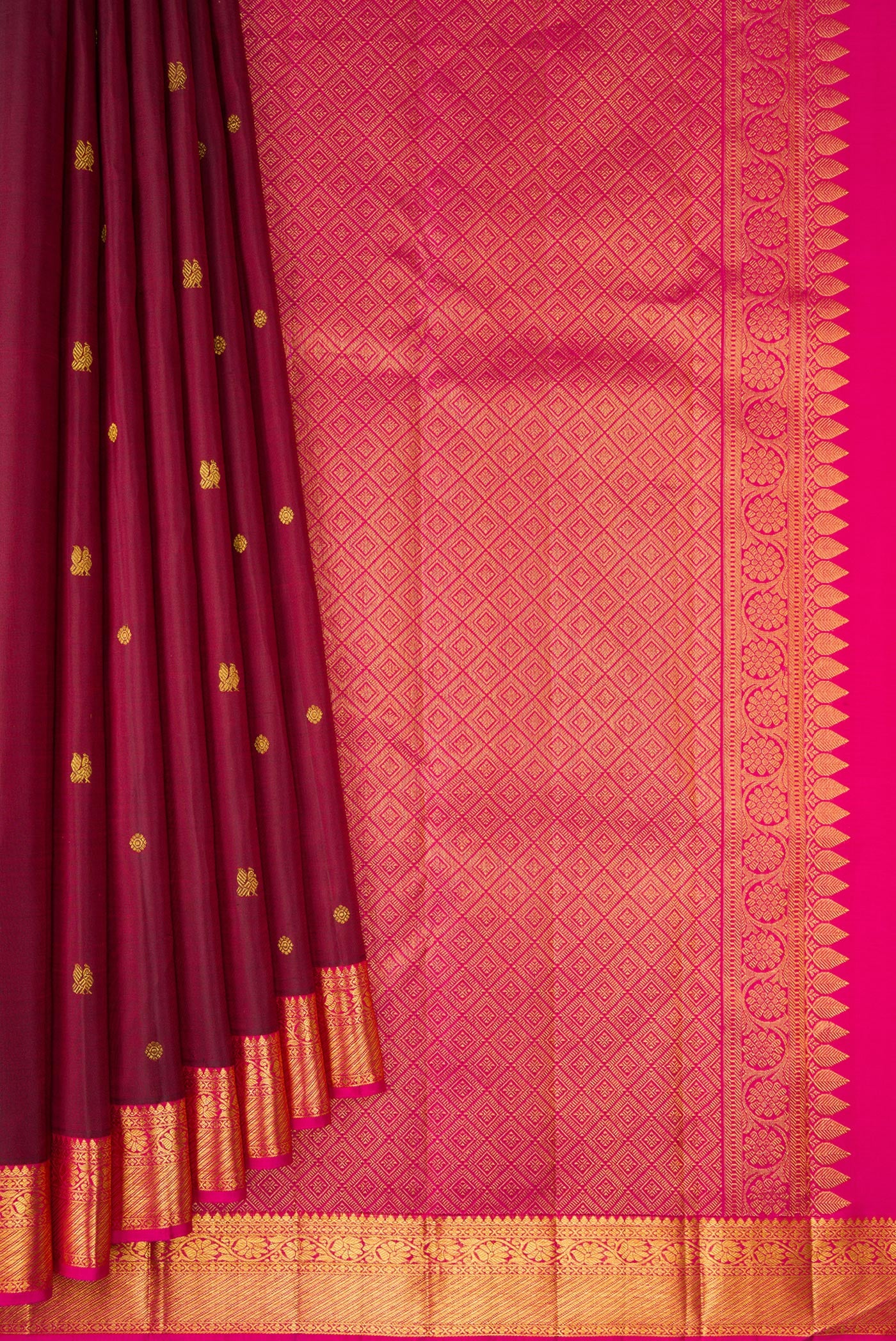 Pleats and pallu of Maroon Kanjivaram Silk Saree with Zari Butta on the body and Zari Border. 