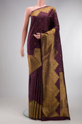 Burgundy Kanjivaram Silk Saree with Zari Butta on the body and Fancy Border.  displayed on a mannequin