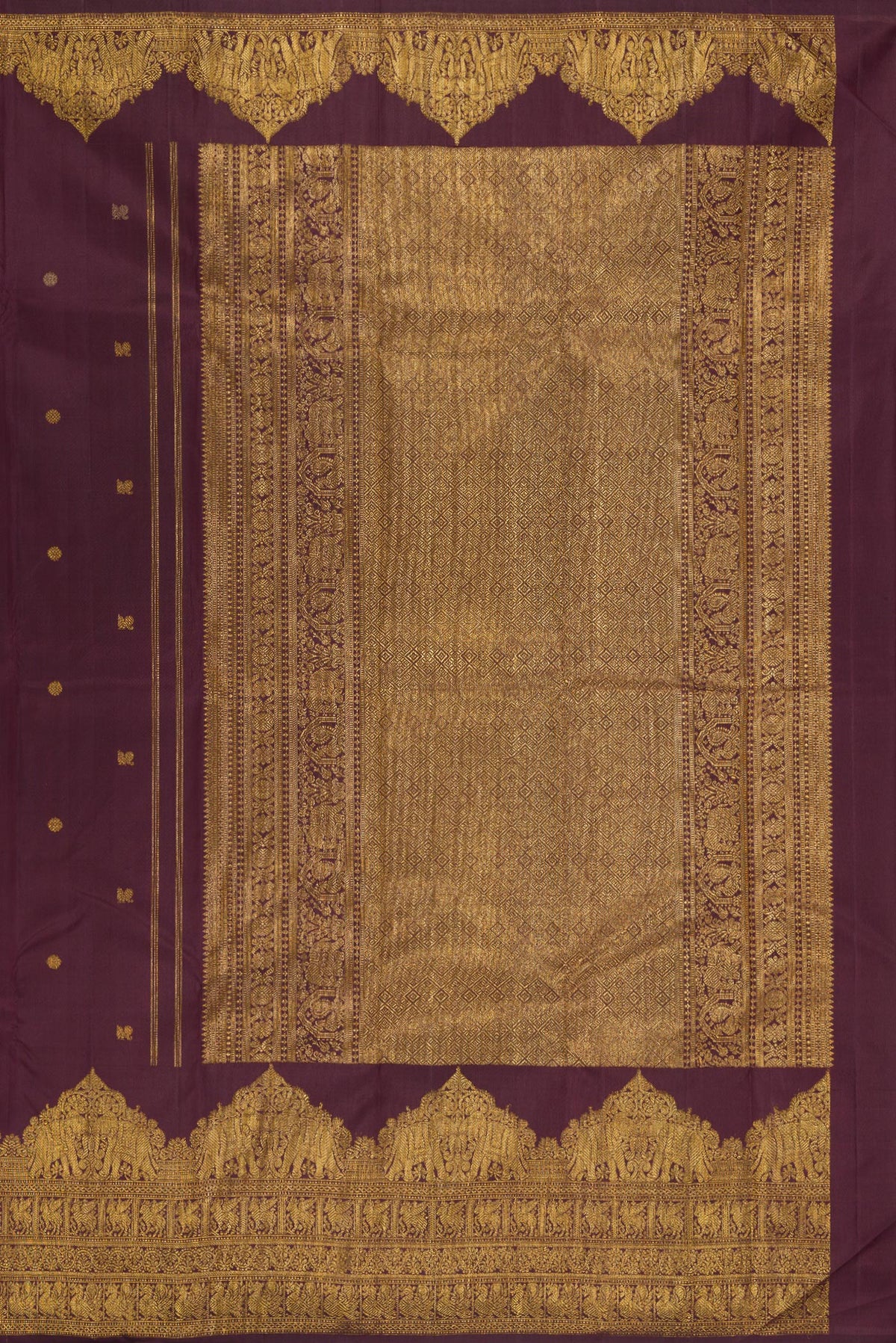 Close up image of the pallu of Burgundy Kanjivaram Silk Saree with Zari Butta on the body and Fancy Border. 