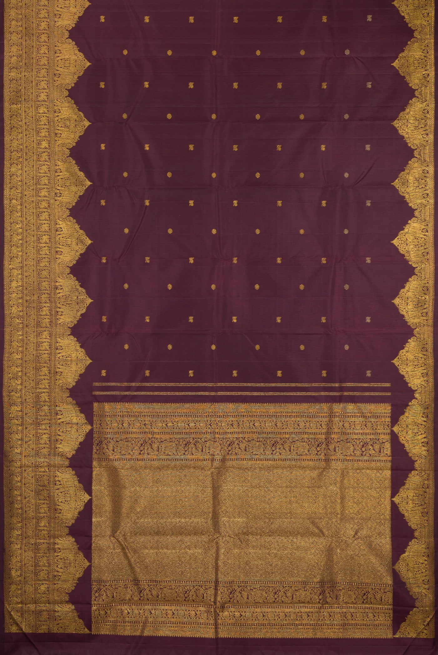 Flat view of Burgundy Kanjivaram Silk Saree with Zari Butta on the body and Fancy Border. 