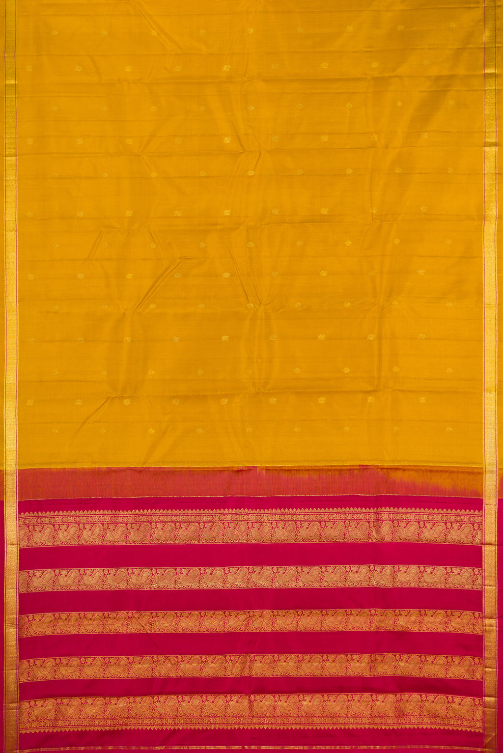 Flat view of Mustard Kanchipuram Silk Saree with Zari Butta on the body and Zari Border. 