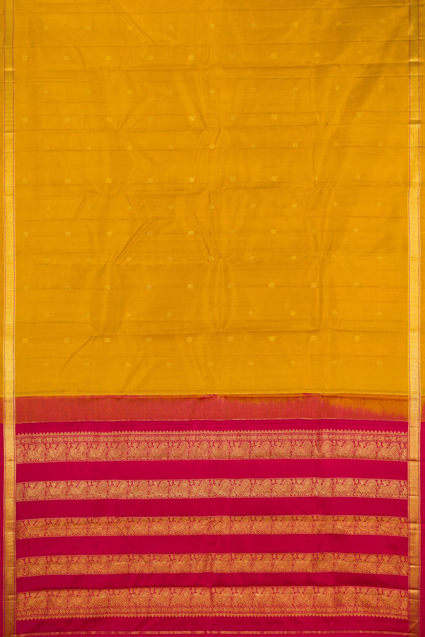 Flat view of Mustard Kanchipuram Silk Saree with Zari Butta on the body and Zari Border. 