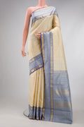 Sandal Kanjivaram Silk Saree with Checked design on the body and Zari Border.  displayed on a mannequin