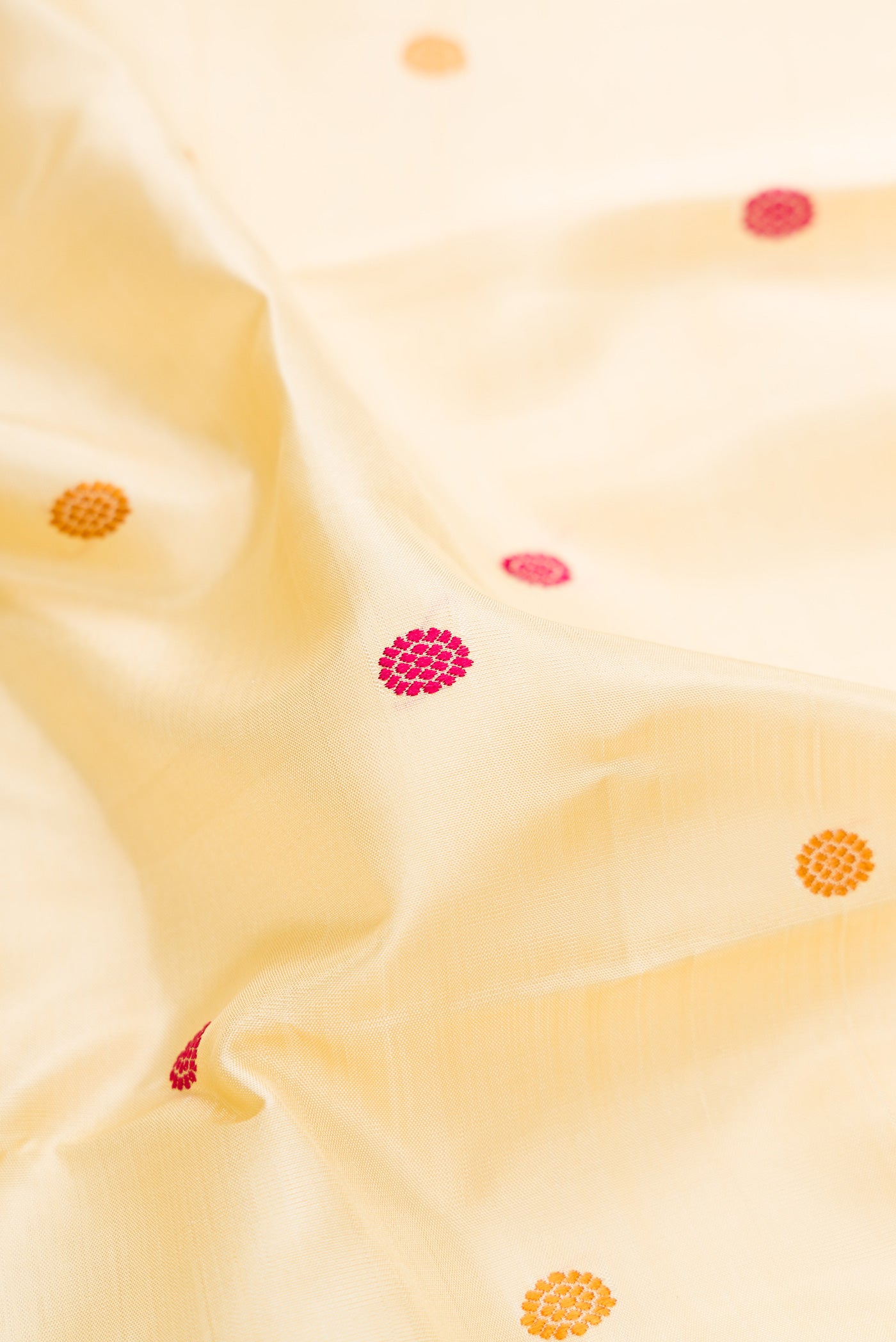 Close up of Sandal Kanjivaram Silk Saree with Zari And Thread Butta on the body and Zari Border.  displaying folds