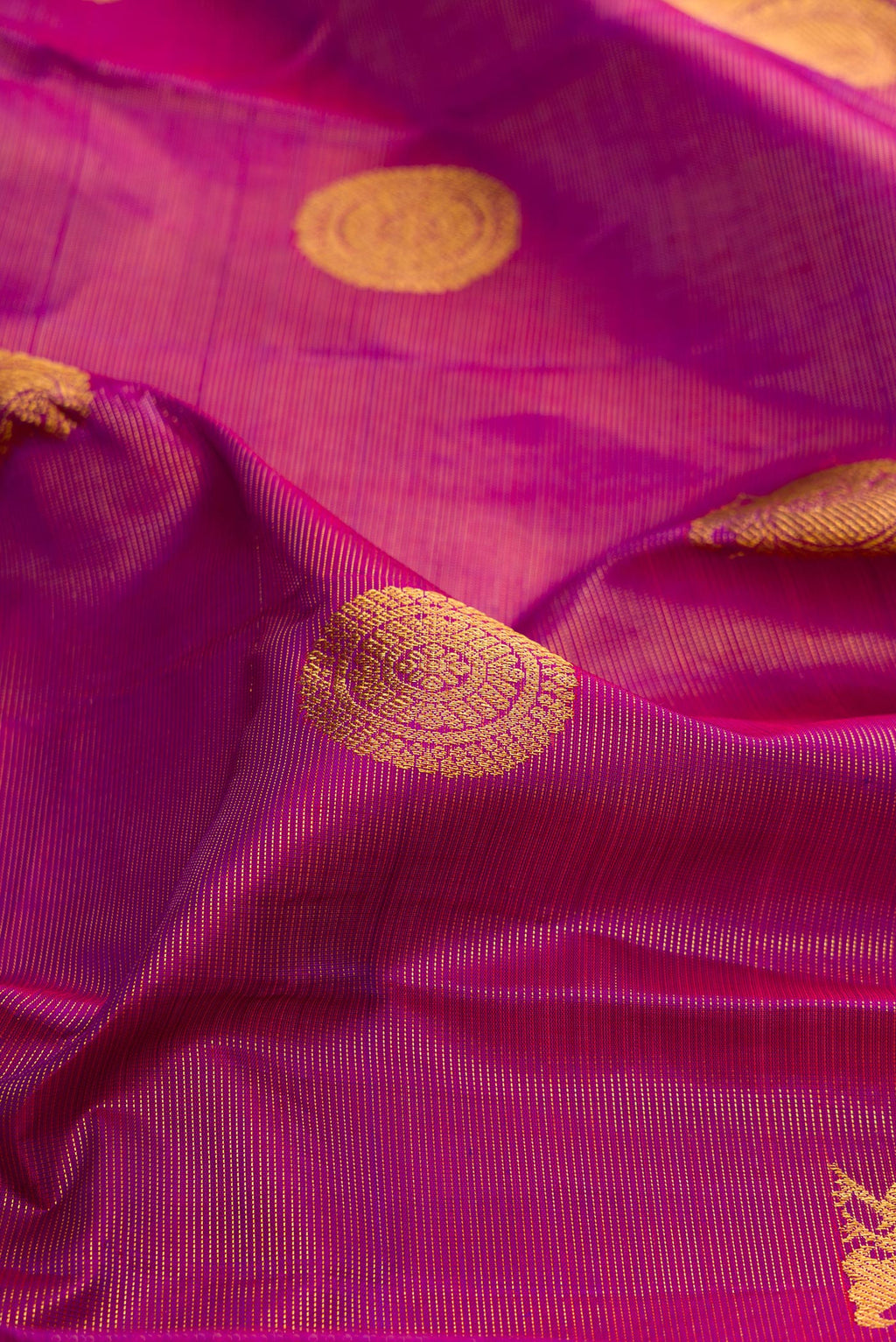 Close up of Purple Kanchipuram Silk Saree with Stripes on the body and Without Border.  displaying folds