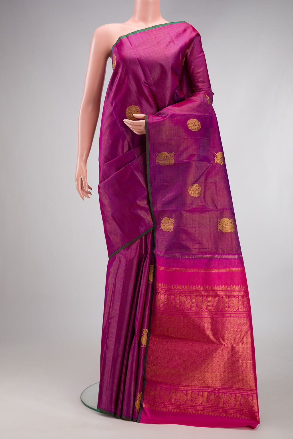 Purple Kanchipuram Silk Saree with Stripes on the body and Without Border.  displayed on a mannequin