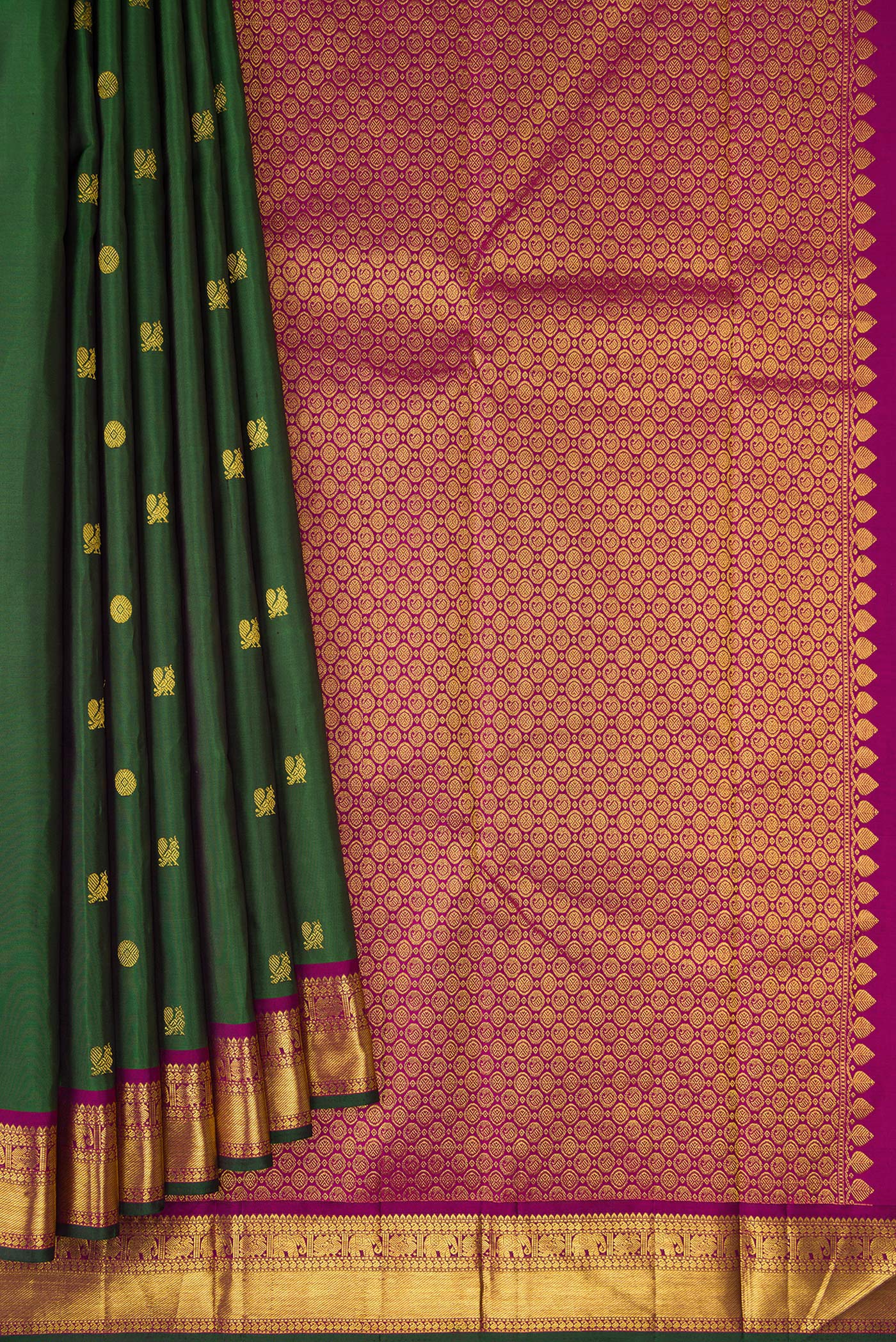 Pleats and pallu of Green Kanchipuram Silk Saree with Zari Butta on the body and Zari Border. 