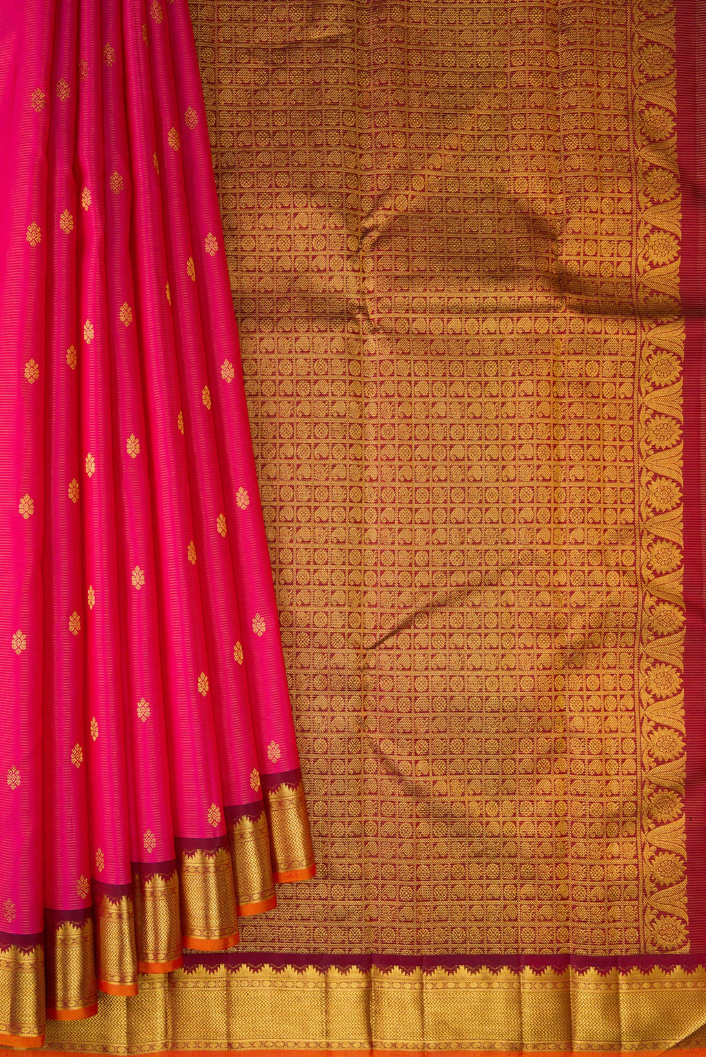 Pleats and pallu of Rani Pink Kanjivaram Silk Saree with Zari Butta on the body and Zari Border. 