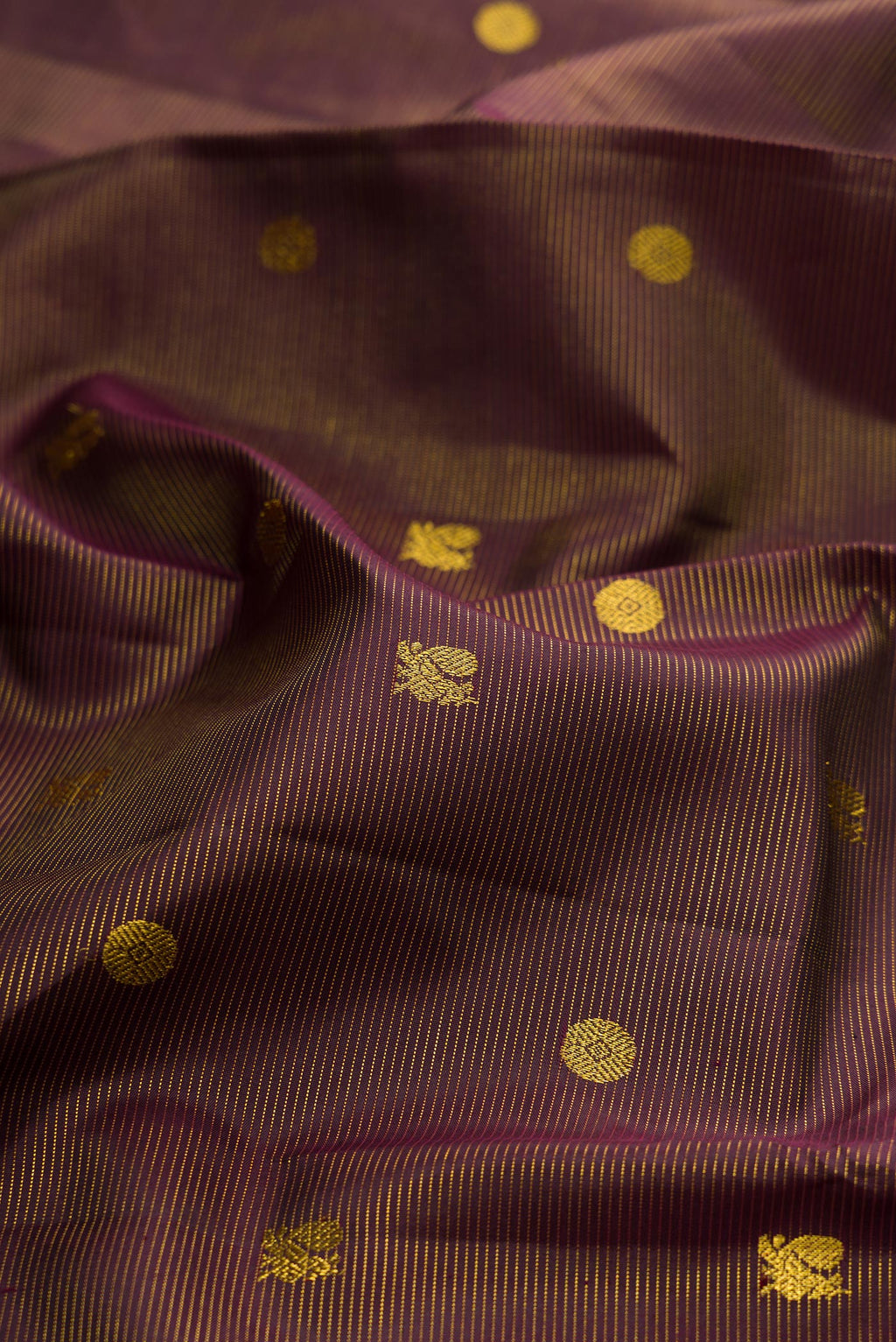 Close up of Coffee Brown Kanjivaram Silk Saree with Stripes on the body and Zari Border.  displaying folds