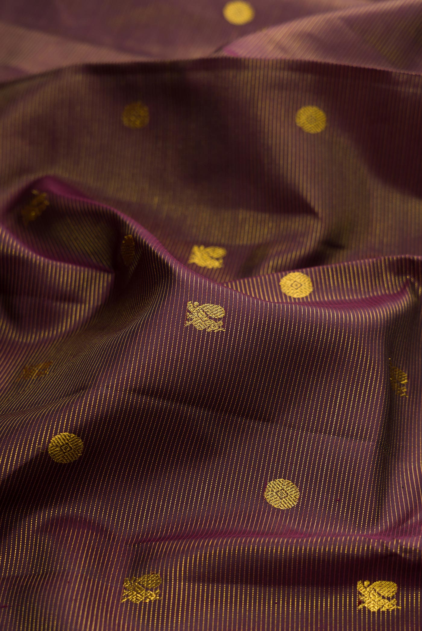 Close up of Coffee Brown Kanjivaram Silk Saree with Stripes on the body and Zari Border.  displaying folds