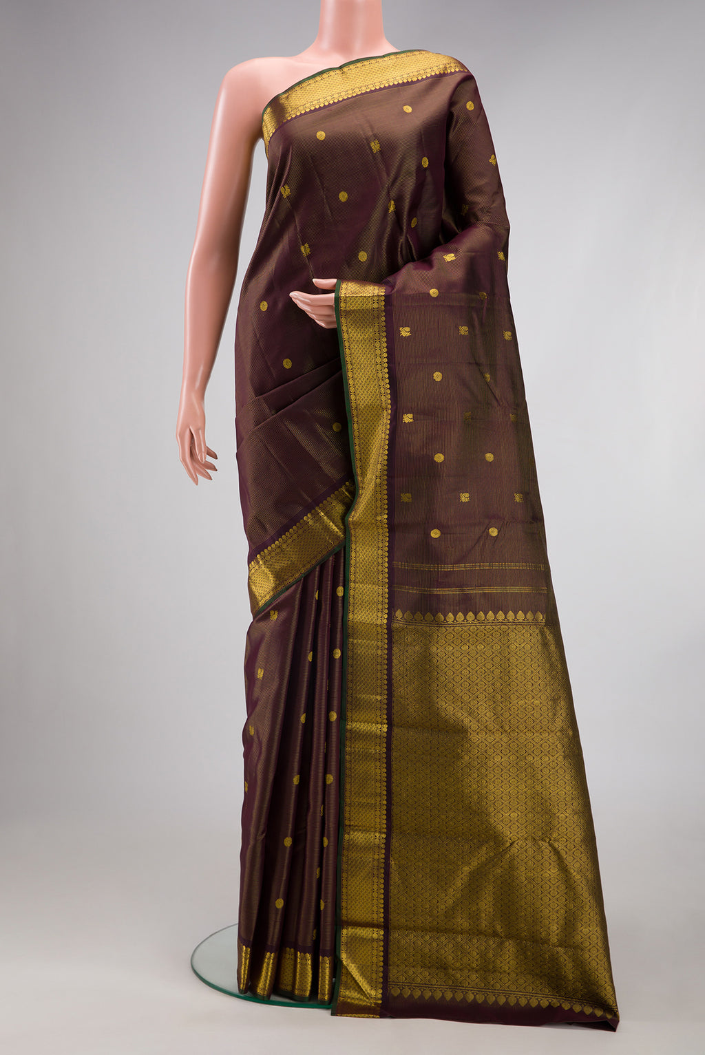 Coffee Brown Kanjivaram Silk Saree with Stripes on the body and Zari Border.  displayed on a mannequin