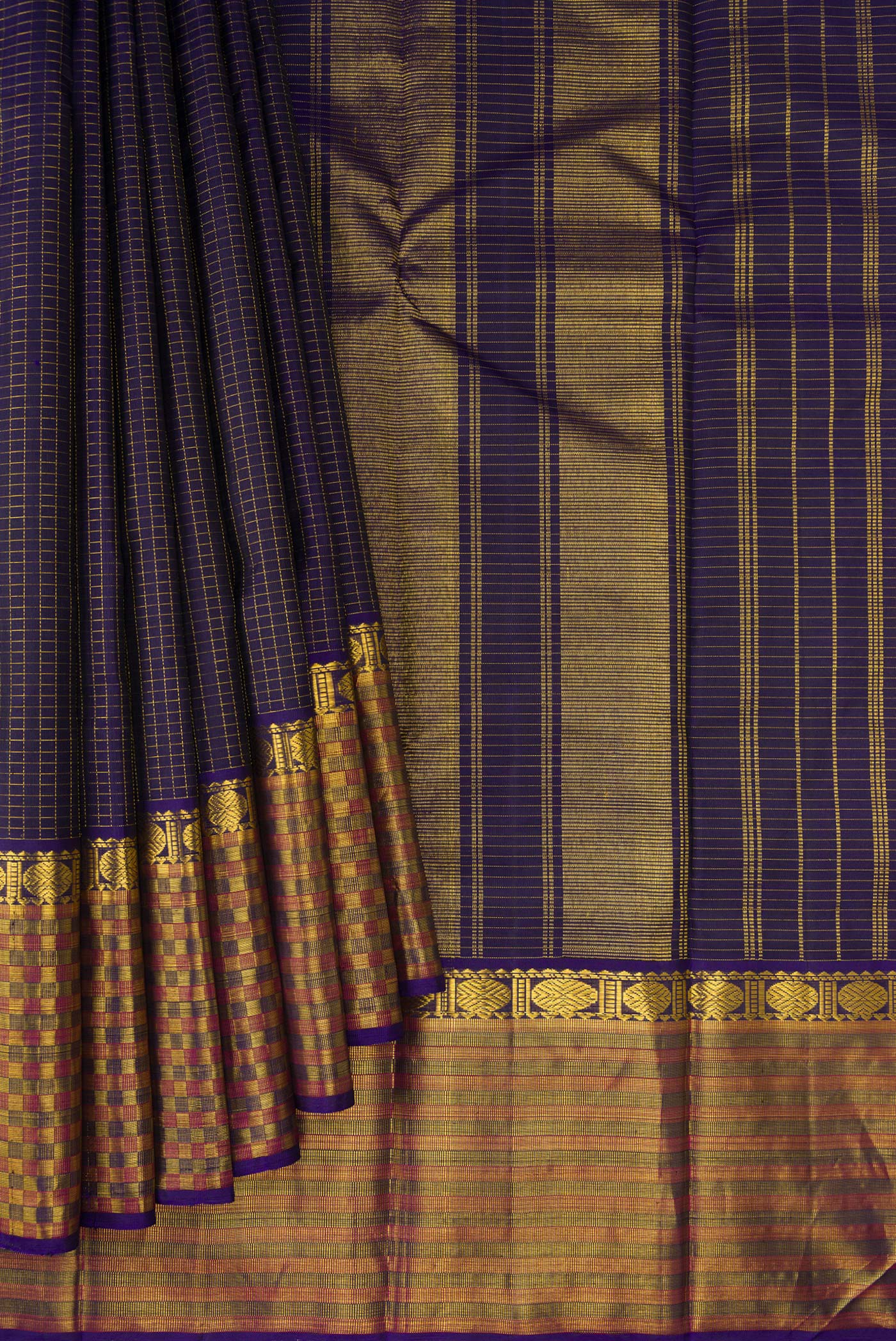 Pleats and pallu of Navy Blue Kanjivaram Silk Saree with Checked design on the body and Fancy Border. 