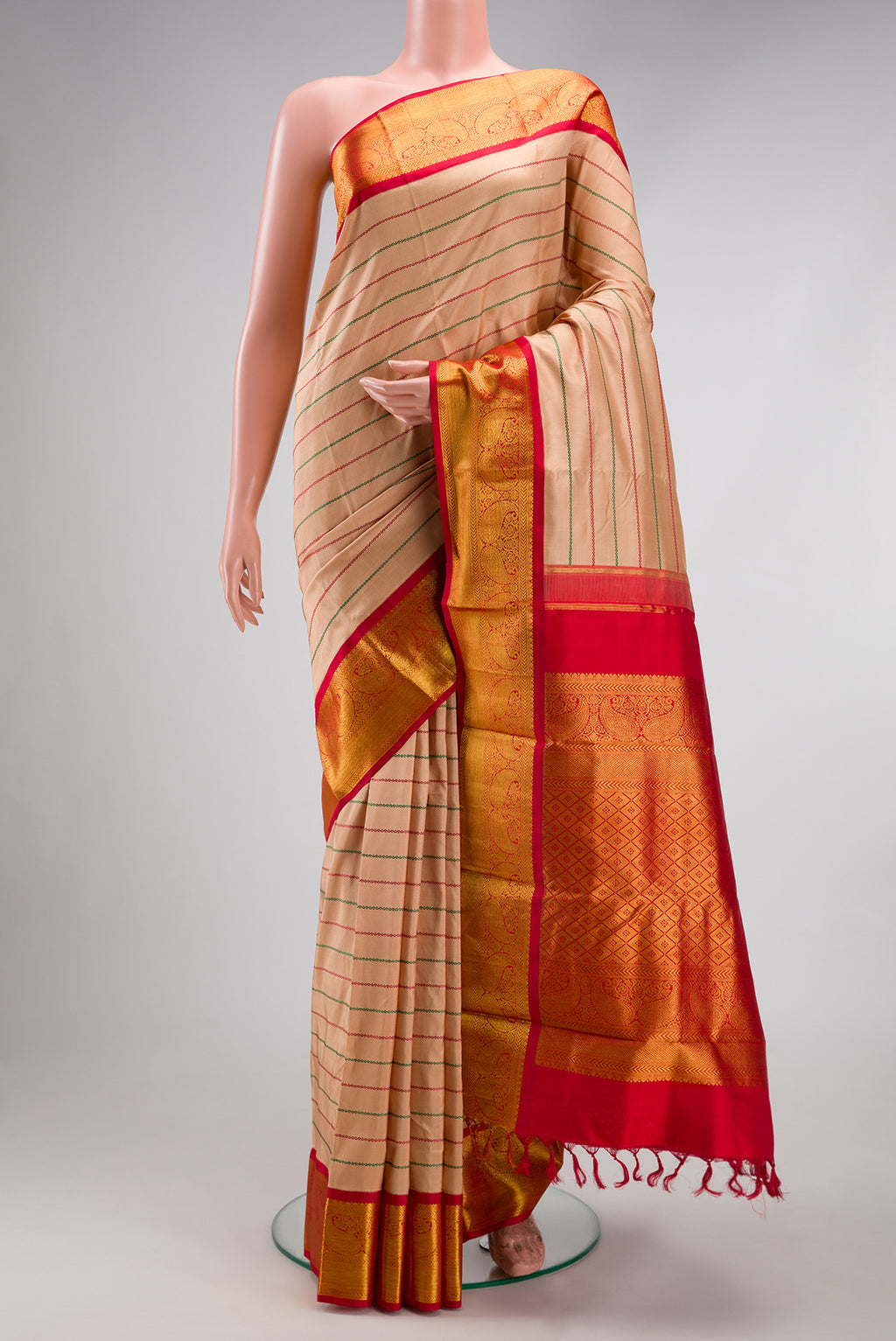 Beige Kanjivaram Silk Saree with Veldhari on the body and Zari Border.  displayed on a mannequin
