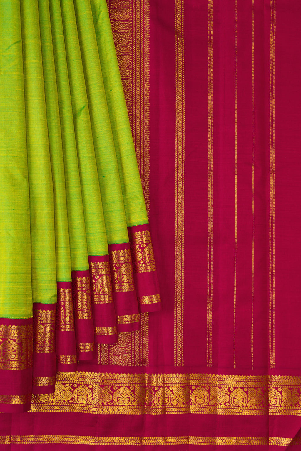 Pleats and pallu of Parrot Green Kanjivaram Silk Saree with Plain Body and Zari Border. 