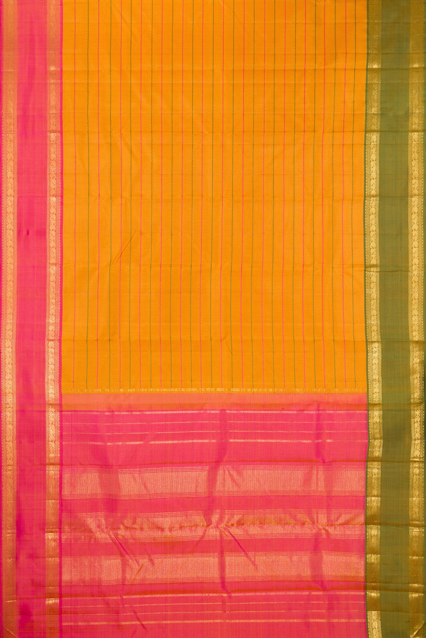 Flat view of Mustard Kanchipuram Silk Saree with Veldhari on the body and Ganga Jamuna Border. 