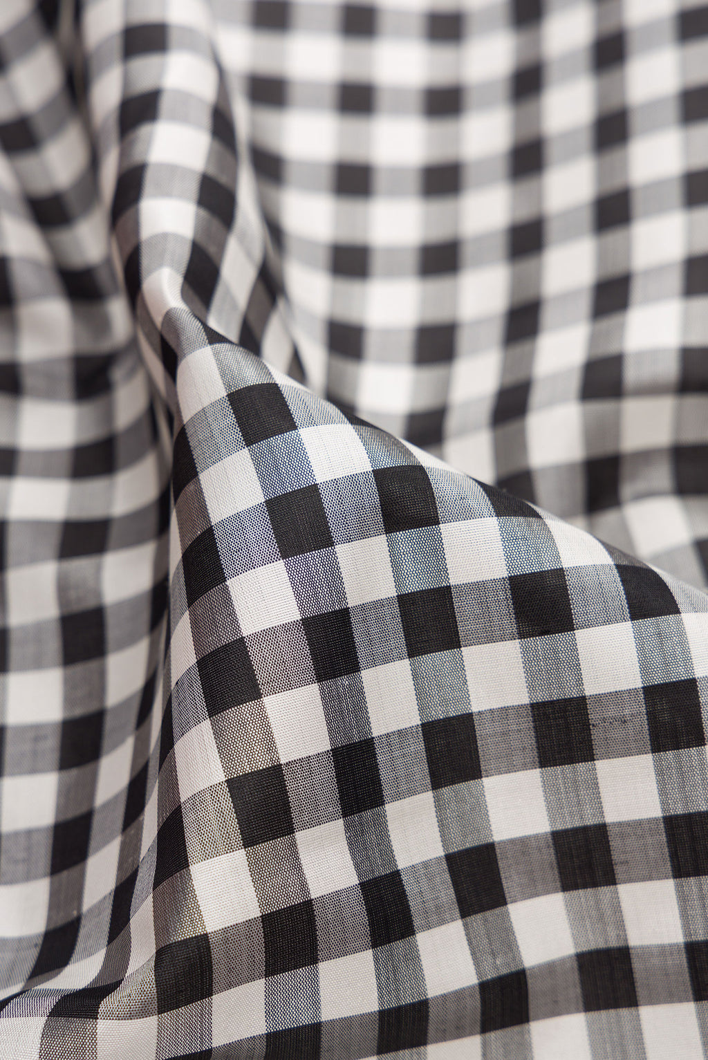 Close up of Multi Color Kanjivaram Silk Saree with Checked design on the body and Zari Border.  displaying folds