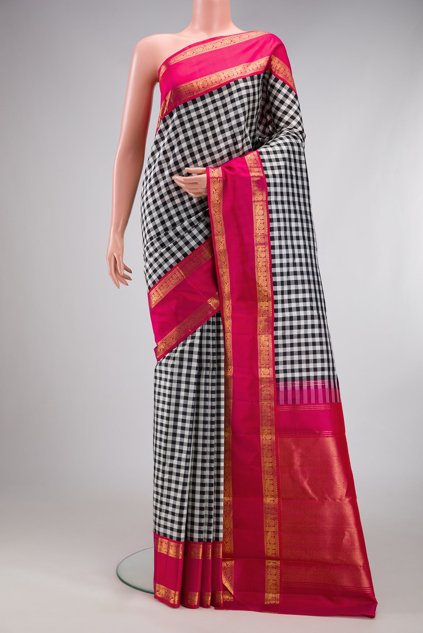 Multi Color Kanjivaram Silk Saree with Checked design on the body and Zari Border.  displayed on a mannequin