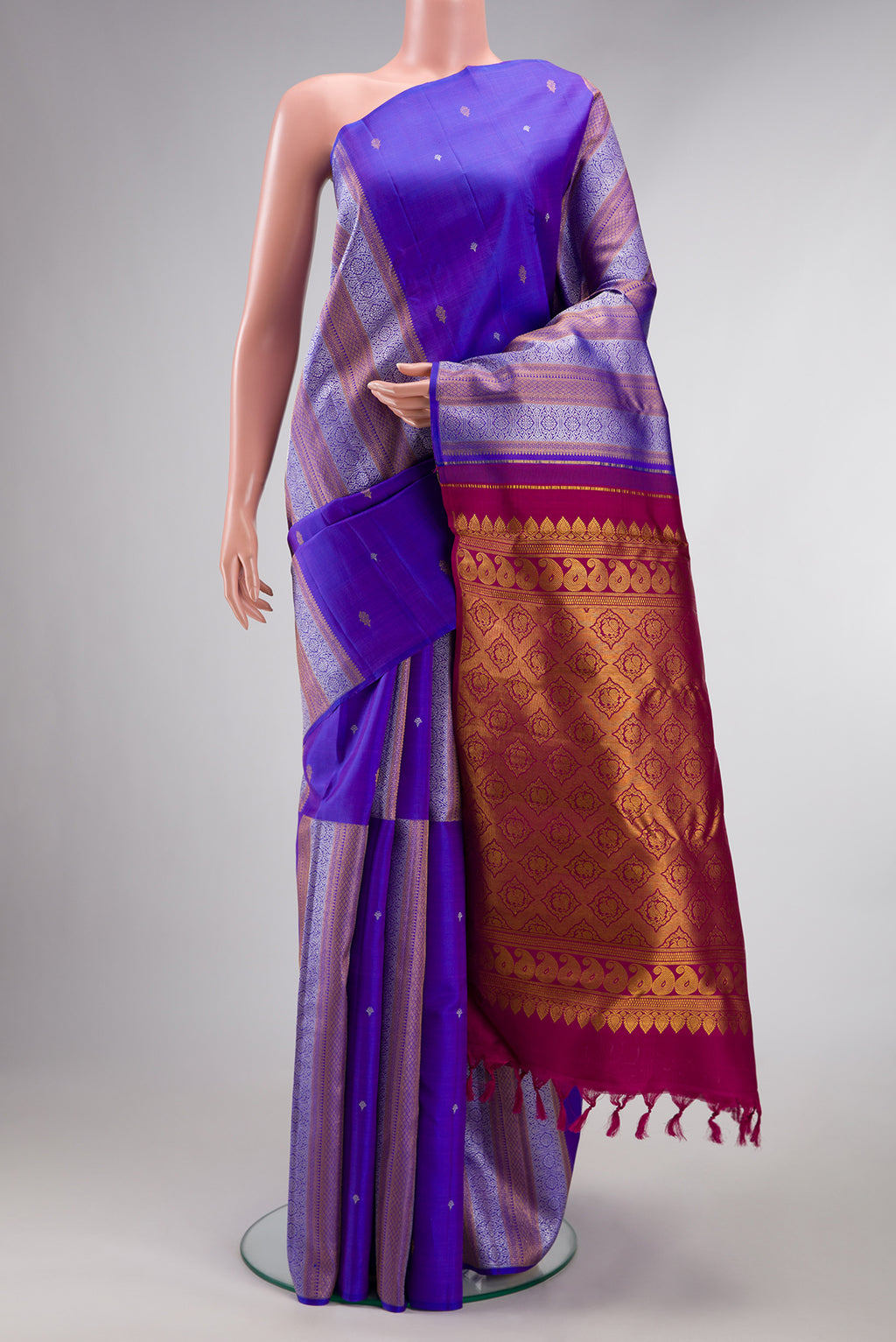 Pure Silk Royal Blue Dual Tone Kanjivaram Saree with Stripes on the body and Without Border.  displayed on a mannequin