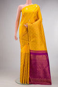 Pure Silk Yellow Kanjivaram Saree with Zari Butta on the body and Without Border.  displayed on a mannequin