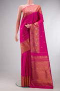 Dark Pink Kanjivaram Silk Saree with Zari Butta on the body and Fancy Border.  displayed on a mannequin